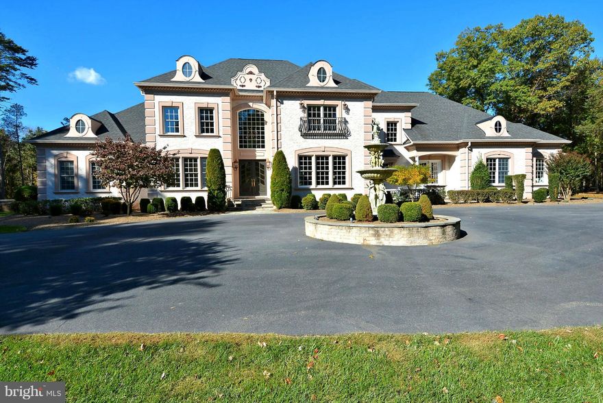 Elegant French provincial style custom brick home on 10 wooded acres w/3 finished levels, over 9,000 fin. sq. ft., w/possibility of 7 BRs, 6 full BAs, & 2 half BAs. Amenities include main level owners' suite w/exercise room, custom luxury BA, custom closet/dressing room w/laundry area, private screened porch, gourmet kitchen for the demanding chef, inground pool w/pavilion & so much more.