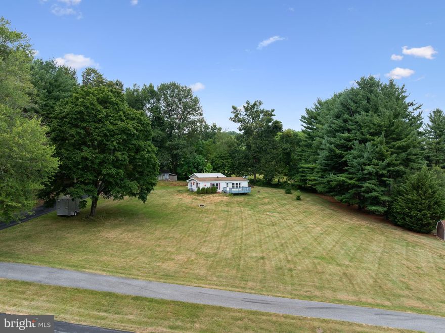 Relax on the front porch of this charming 2-bedroom, 2-full-bath home and take in the breathtaking mountain views. Nestled on just under an acre, this property offers both privacy and space to enjoy the outdoors. Inside, you'll find a spacious primary bedroom with an  en-suite bath, family room perfect for gatherings, Remodeled kitchen and a comfortable dining area for everyday meals or entertaining. For the car enthusiast or anyone needing extra space, there's a 24' x 24' oversized detached garage—ideal for vehicles, hobbies, or additional storage. Don’t miss the chance to own this peaceful mountain retreat!