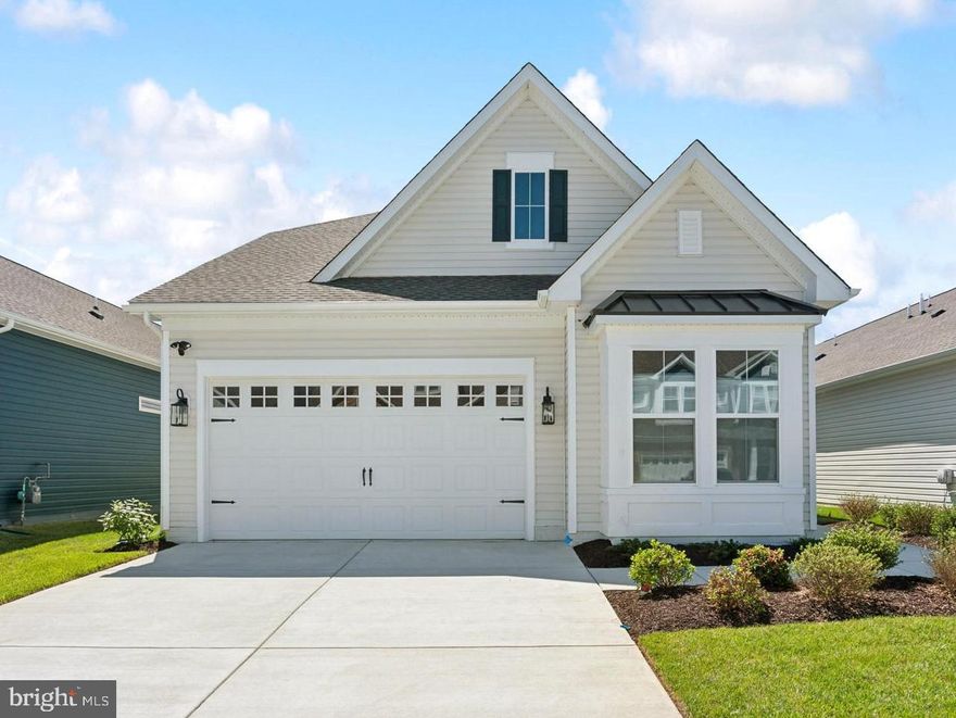 Welcome to the Simone, a beautifully designed home offering 4 bedrooms, 3 baths, and a 2-car garage. Scheduled for settlement in July 2026, this home combines thoughtful design with comfortable living spaces ideal for both everyday life and entertaining.

The main living area features a cozy one-story fireplace, creating a warm and inviting focal point. A dedicated home office provides a private space for work or study, while the screened patio extends your living area outdoors—perfect for relaxing or hosting guests.

The kitchen is designed for both style and function, featuring a single oven, microwave, gas cooktop with range hood, dishwasher, French door refrigerator, pendant lighting, tile backsplash, and quartz countertops. Quartz is also featured in the owner’s bath for a cohesive and elegant finish.

Luxury vinyl plank flooring runs throughout the foyer, extended foyer, kitchen, dining area, great room, bedroom 2, owner’s suite, HovHall, loft/second floor, and bedrooms 3 and 4. Tile flooring is featured in all full baths and the laundry room. The owner’s bath includes a walk-in shower with a seat and handheld shower wand, along with a double-sink vanity for added comfort and convenience.

For a full list of features for this home please contact our sales representatives. 
Photos are for illustrative purposes only and may not represent the exact home or finishes available.

Welcome to a new luxury active adult 55+ community on Maryland's Chesapeake Bay. Discover the amenity-filled, resort-style experience within 45 miles of Washington DC and Baltimore. Residents can take advantage of the community's 24,000 sq. ft. clubhouse with indoor & outdoor pools, a state-of-the-art fitness center, and multiple tennis and pickleball courts. With a full-time lifestyle director on site the community also features a well-maintained calendar of activities such as walking club, indoor and outdoor yoga sessions, mahjong club, kayaking, pickleball and more. Kent Island life is about making friends and enjoying the company of people who have worked hard and now want to enjoy all that a luxury 55+ community has to offer. Located steps from the water and minutes from Annapolis, the location also offers quick access to Rt. 50. Enjoy the convenience of nearby dining and shopping options together with the quaint charm of a small town.