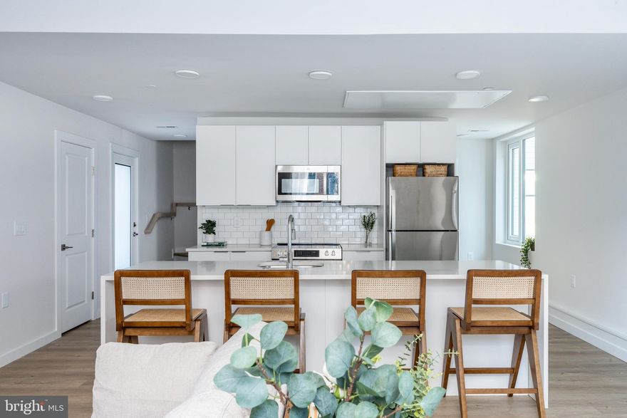 Now offering 3 months free for a 15 month lease. List price reflects net price with 3 months credit applied.  Welcome to this beautifully designed new construction townhome style apartment, located in Fishtown! Enter through your private entrance into a spacious open floor plan living area. The first floor features a well-appointed oversized kitchen island with a gorgeous quartz stone countertop that spills over each side of the island for a tasteful, high-end, waterfall design. The kitchen includes brand-new stainless-steel appliances including a perfectly sized range, dishwasher, refrigerator, garbage disposal, and microwave. You'll be very pleased with the amount of cabinet space throughout the kitchen, as well as the rare pantry; allowing plenty of storage space! Located off the kitchen, you will find your Private Patio; the picture-perfect space for catching some fresh air with your morning coffee or evening glass of wine! Completing the first floor is a lovely powder room, additional storage/coat closet, and a Laundry Closet with brand-new washer & dryer appliances. 

On the second floor, this apartment features 2 en-suite bedrooms! Both bedrooms feature plenty of closet space, large windows, and access to their private full bathrooms. The full bathrooms feature stunning vertical floor to ceiling shower tile and an attractive vanity with cabinetry. 

Located in Fishtown, the restaurant, food and bar scene is endless! To name a few, you'll enjoy the short walk it is to Garage, Murph's Bar, Frankford Hall, Front Street Cafe, Middle Child Clubhouse, Milkcrate Cafe, and much more! This apartment has access to a community Fitness Center equipped with peloton bikes, pilates reformers, treadmills, rowers, dumbbells up to 100lbs, and additional cross-training machines. The apartment is pet friendly! You'll enjoy the complimentary Dog Spa that includes 2 large wash tubs and treats, as well as the Pet Rest Stop for those late-night pit stops, equipped with bags. The additional amenities available are outstanding lobby area equipped with a convenience marketplace store, complimentary coffee, fireplace lounge, co-working space, speakeasy, amazon locker room.. the list goes on! 

*Floor plans and renderings are artist's interpretations. All dimensions are approximate and not to sale or proportion. Actual product and specifications may vary in dimension or detail. Leasing specials are subject to change. See a representative for details.