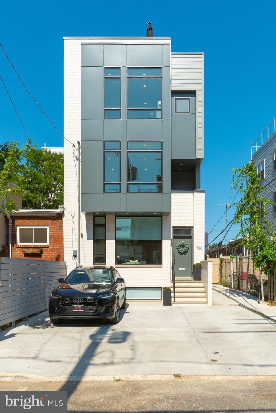 Your Unicorn is here! This rarely offered, one-of-a-kind home is tucked away on a low-traffic block, where Francisville meets Fairmount. 766 N Uber Street is a stunning 5 bed, 5.5 bath, semi-detached home full of designer finishes and thoughtful details. Designed by a highly sought after Philadelphia architect, every nook and cranny of this home was thoughtfully crafted. The 21  wide home provides space on every floor that is unmatched in comparison to a traditional Philly rowhome. The home offers everything you d want and more: 3 car parking, a SECOND FLOOR MASTER SUITE, full finished basement with HEATED floors, two wet bars and a massive roof deck with unmatched skyline views. As you walk in the front door, the first floor features a beautiful open floor plan. The Chef s kitchen is well appointed with Wolf/ Viking appliances, massive island with a quartz counter top and a gorgeous herringbone pattern backsplash. Thoughtful touches include an oversized farmhouse sink, potfiller faucet over the stove and an oversized waterfall counter on the island. The island also includes a secondary prep sink. The living space includes massive windows on three sides of the home, illuminating the space with natural light. The private rear yard is perfectly shaded for hot summer days to grill or let your furry four legged children out. The patio also includes a gas line for easy grill hookup. Not to mention, this first floor also includes a conveniently located powder room and an oversized coat closet   essentials for any first floor of a home. On the finished lower level you ll find a large den/media room with a wet bar and a separate guest suite with full bathroom. The floors are heated for cold days and both the bedroom and media room are on different thermostats for convenience. As you ascend the custom open-riser staircase to the second level, there s a guest bedroom, full hall bathroom, and laundry room. But more importantly, this level is where you will find the thoughtfully placed owner s suite comprised of a large bedroom with floor to ceiling windows, two custom closets, and a deck. The spa-like en-suite provides a daily retreat with its freestanding soaking tub, glass-enclosed shower, double vanity, and designer 36 x36  tile throughout. On the third level, there s a guest en-suite, guest bedroom, full hall bathroom, and a large office with glass French doors, which could double as another large bedroom. A wetbar anchors the stairs leading up to the MASSIVE roof deck. Running the full length on the home, with fabulous, unobstructed city views, this roof deck is an entertainer s paradise - another gas line is conveniently hooked up here, so ditch the propane tanks! This prime Francisville location is steps away from Fairmount and has a Walk Score of 91. Nearby dining includes Telas, Bar Hygge, Rybread cafe, and Engimono Sushi. Nearby shopping includes Whole Foods, Target, and Fine Wines & Good Spirits. Opportunities like this don t come often! Contact us today for in-person and virtual touring options!! See attachments for floor plans and installed upgrades *All square footage numbers are approximate and include above and below grade square footage. Square footage & real estate taxes should be verified by the buyer.*
