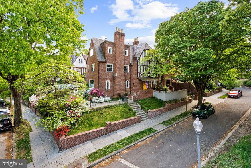 FIRST OPEN HOUSE SATURDAY MAY 16TH & SUNDAY, MAY 17TH FROM 2:00-4:00PM! 4400 Q Street NW sits in one of Washington, DC’s most desirable neighborhoods, on an expansive corner lot—one of the largest in Foxhall Village—offering the charm of classic architecture with easy access to Georgetown, downtown DC, and nearby parks along the Potomac River. The home showcases a classic brick exterior with traditional charm, complementing its setting on a tree-lined street.

Inside, the main level features a bright, open living area with hardwood floors, recessed lighting, and architectural details like curved archways and elegant built-ins. A cozy fireplace anchors the living room, and picture windows fill the space with natural light. The dining room connects seamlessly to the fully renovated kitchen, which offers contemporary cabinetry, sleek countertops, stainless steel appliances, and a spacious central island.

The second floor features four bedrooms, including a large primary suite with a beautiful corner view of Foxhall Village. The top floor is a private and exceptionally large bedroom suite with a sitting room and a fireplace, a walk-in closet, and expansive windows offering beautiful open views and abundant natural light.

Adding to its versatility, the property includes a fully finished basement with two bedrooms and 1.5 baths. This flexible lower-level apartment/suite has its own entrance and a second kitchen, making it perfect for guests, extended family, an au pair, work space, or additional living space. Outside, the landscaped patio provides a private space for entertaining or relaxation, and off-street parking on the driveway as well as the attached garage adds convenience to this rare Foxhall Village offering with scale, light, flexibility, and modern comfort.

Square footage estimated from third party source.