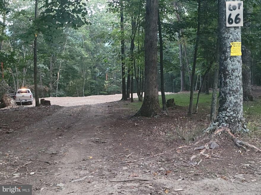 Beautiful building lot ready for your dream home. Peaceful setting, perfect for Homesteading.  Livestock, chickens, etc are allowed.  Also hunting/shooting/ manufactured homes/ATV"s permitted.  Wooded and open 5.25 acre building lot ready for you to start building. Private and peaceful, and lots of wild life. Property has been perked, electric service installed, driveway and pad excavated and lot seeded. Must see to appreciate. Light deed restrictions and $25/year road maintenance fee.  Rare find these days. Great hunting right from your own property!! And just 5 minutes from the Cacapon River for floating, fishing (really big catfish) and swimming. . Enjoy quiet living just minutes from Berkeley Springs. Easy access to hospital, grocery, restaurants, and more. Enjoy the antique mall shops, and short trips to Cacapon Resort State Park, or take a historic walk at Prospect Peak and so much more.
PENDING RELEASE