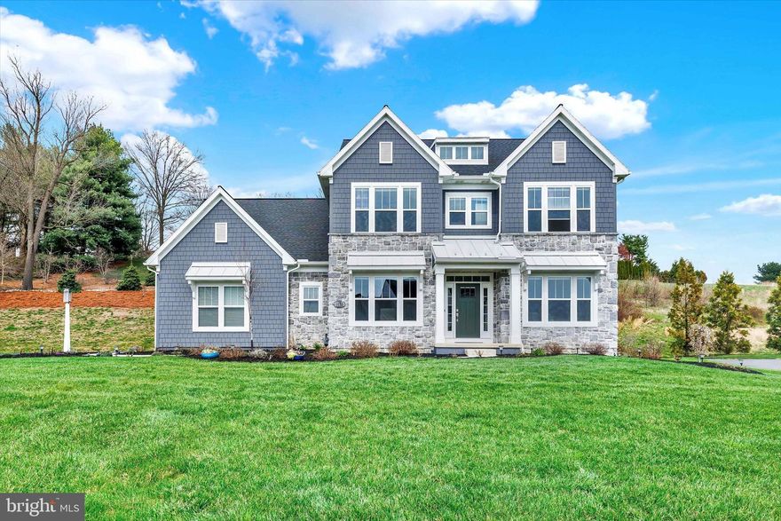 This beautiful home is now available for sale, located in the highly sought after neighborhood of Lititz Bend. Located just minutes from the heart of downtown Lititz, and within the highly-rated Warwick Area School District, this like-new home, the Decker model, was meticulously crafted by Garman Builders in 2023.  After admiring the welcoming curb appeal, a bright, open foyer leads you inside this stunning home which boasts an impressive 3,142 square feet of living space and 9-foot ceilings throughout. A formal dining room sits to the left with elegant columns, a tray ceiling, tall wainscoting, and an upgraded light fixture, and to the right you will find a comfortable office with lots of light and a double door entry. Straight ahead an open concept kitchen will impress you with a modern white backsplash, ceramic farmhouse sink, beautiful quartz countertops, a walk-in pantry with upgraded wood shelving, and new stainless steel Kitchen-Aid appliances that include a gas range, exhaust hood, and a wall oven. This amazing space includes triple sliders for the most amount of light, and it flows seamlessly into the generous family room that is complete with a stone and shiplap gas fireplace and triple windows that look out into the backyard. Also on this level is a pretty powder room, and a mudroom with custom cabinetry. A lovely staircase then leads upstairs, where the master bedroom is sure to become your oasis with an expansive tray ceiling, walk-in closets with custom organization, and a spa-like master bath complete with a double-sink vanity and a huge glass enclosed shower. The additional three bedrooms are all nicely sized, all with ceiling fans and plenty of closet space, and share a roomy full hallway bathroom, also with a double sink vanity. And you will love the upstairs laundry with modern open shelving. Downstairs the basement has plenty of storage and superior walls. Then, outside, the large .59 acre lot has plenty of space including large side yard areas, and a composite back deck with vinyl railings. The upper portion of the backyard was also thoughtfully landscaped and provides abundant privacy. Other notable features of this gorgeous home include: a water softener, honeycomb Levolor blinds throughout the interior of the home, faux wood Levolor blinds in the garage, remotes for all of the living room and bedroom ceiling fans, wooden shelving in the upstairs hall closet, and a 3-car side-entry garage. So call today for your private showing! You will not be disappointed! A One-year Cinch Home Warranty is included.