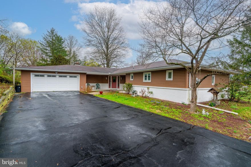 Step back into the charm of the 1970s with this spacious and well-maintained ranch-style home, offering nearly 2,000 square feet of comfortable living space. This single-level gem features three generously sized bedrooms and two full baths, ideal for those seeking room to spread out. At the heart of the home is a classic sunken living room—a signature design element of the era—perfect for entertaining guests. Just off the kitchen, a cozy family room with a gas fireplace offers a warm and inviting space for gatherings or quiet evenings in. Large windows invite natural light, while the open layout creates a seamless flow between the living, dining, and kitchen areas. The eat-in kitchen offers lovely cherry cabinetry with plenty of counter space and storage. Down the hall, you’ll find a primary suite with an en-suite bath, two additional bedrooms, and a second full bathroom. Set on a sizable lot, the home also includes a two-car garage, mature landscaping, and a backyard ready for your personal touch. Many recent updates including new windows, motorized blinds in kitchen and new patio doors with built in blinds. This retro ranch is full of character and is just waiting for the right owner to make it their own.