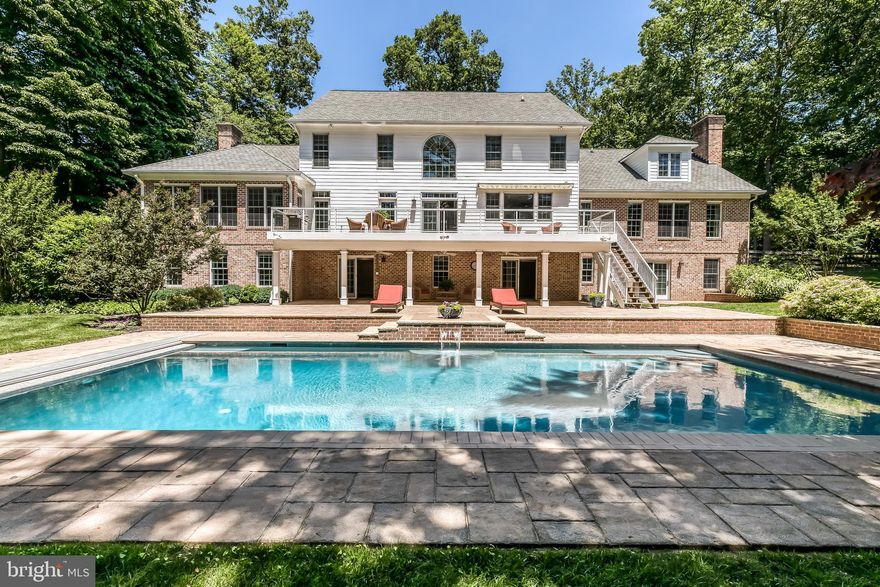 Gracious custom built colonial with "wow" and fine finishes plus contemporary proportions is situated on nearly three private acres in gated community bordering the Greenspring Valley. 6 Bedrooms, 5 Full Baths, 1 Half Bath plus a multitude of indoor and outdoor entertaining spaces. Beautiful light-filled formal rooms and sophisticated casual spaces feature high ceilings, wide quarter sawn hardwood flooring, exquisite millwork and five fireplaces. Grand foyer with remarkable curved staircase opens to living room and dining room with gas fireplace. Handsome gourmet kitchen with custom cherry wood cabinetry, stainless high-end appliances, large island, coffee bar, and breakfast room. Kitchen opens to a library/family room with gas fireplace and uber stylish great room with soaring ceiling, wood burning stacked stone fireplace and second staircase. The main level master bedroom suite with two walk-in closets and gas fireplace opens to sunroom and new luxury bath with soaking tub, large marble shower, and sauna. Second level features large bedrooms, en suite baths and bonus room/studio with skylights. Expansive finished basement includes an au pair suite or second family room with gas fireplace, full bath, fitness room, media room, and abundant storage. Main level country-sized laundry with room for pets and lacrosse sticks opens to 3-car garage with wall-mounted storage systems. Saltwater heated swimming pool with cascade waterfall is surrounded by stone terraces with sitting walls. Deck with glass panel rail system and covered terrace below are perfect for crab dinners! Beautiful views of green space, pasture, perennial gardens and rolling lawn merge to woodlands providing diverse habitats for a multitude of native plants and animals. Nature abounds - enjoy the cacophony of peepers in near-by ponds on warm summer evenings, and seasons defined by wildlife who make the valley their home. Outdoor enthusiasts are drawn to the area known for steeplechase and equestrian events, horseback riding, biking, and golf. Valley neighbors are committed to conservation and take pride in protecting open space and the rural and agricultural character of this renowned region. Convenient to premier shopping complexes, schools, I-695. Minutes to Metropolitan Baltimore.