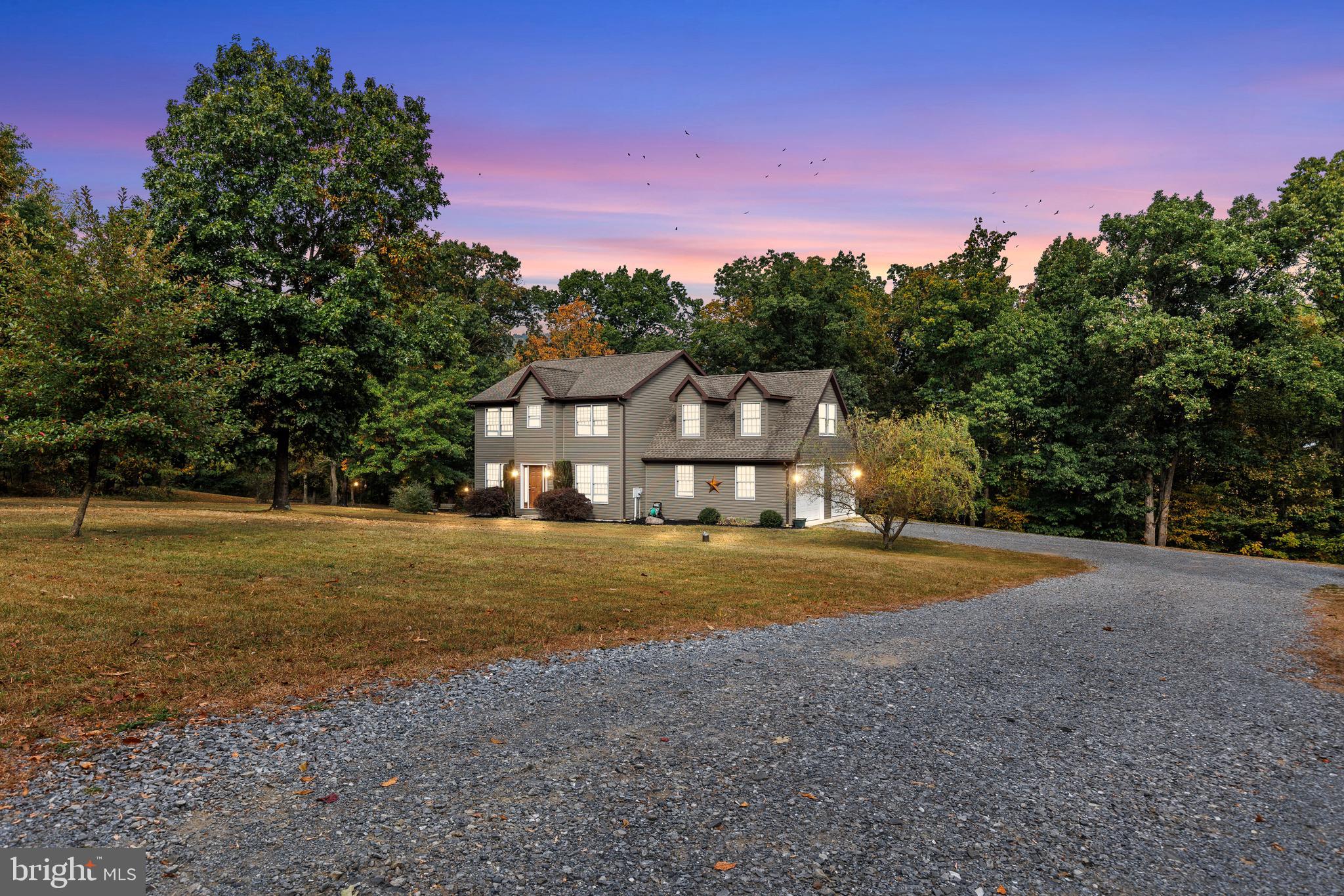 Welcome to 14731 Shimpstown Road! Situated on 5.1 acres of partially cleared and wooded land, this home offers privacy and a peaceful setting with plenty of space to enjoy the outdoors. The home features 4 bedrooms, 2 full bathrooms, 1 half bathroom, a spacious living area and dining room, large kitchen, and a convenient main level laundry room. A deck off the kitchen provides the perfect spot to relax or entertain. Enjoy radiant floor heating throughout the home and garage powered by a wood-burning stove with oil backup, plus central A/C for year-round comfort. Attached 2-car garage with heated concrete floors. The unfinished basement provides an excellent opportunity to create additional living space. Roof replaced in 2011. If you are looking for a home in a quiet and peaceful country setting with a large lot, this may be the home for you. Schedule a showing today! Sale is contingent on the seller finding suitable housing.