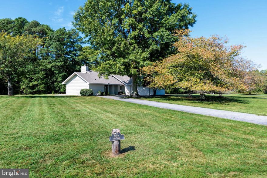 Tucked on a private 1-acre corner lot in the desirable Cove Creek community, this home offers 3 bedrooms, 2 baths, and 1,538 square feet of single-level living. Following a complete renovation, every detail has been refreshed—pairing modern updates with a light-filled open floor plan. Expansive windows and vaulted ceilings create a bright, airy feel, while the family room’s wood-burning fireplace adds warmth and charm. The first-floor primary suite is a true retreat with a spacious walk-in closet and en suite bath featuring a dual-sink vanity. Two additional bedrooms provide flexibility, while a new roof and updated energy systems deliver comfort and efficiency. Outdoor living is equally inviting with a large back deck and porch overlooking mature landscaping, plus a two-car garage for convenience. Residents of Cove Creek enjoy resort-like amenities including an 18-hole golf course, clubhouse, tennis and basketball courts, bocce courts, marina, private beach, exercise facility, and miles of walking trails. Whether as a full-time residence or a weekend retreat, 102 Golf Ct blends the ease of a total renovation with the amenities of a true resort community.