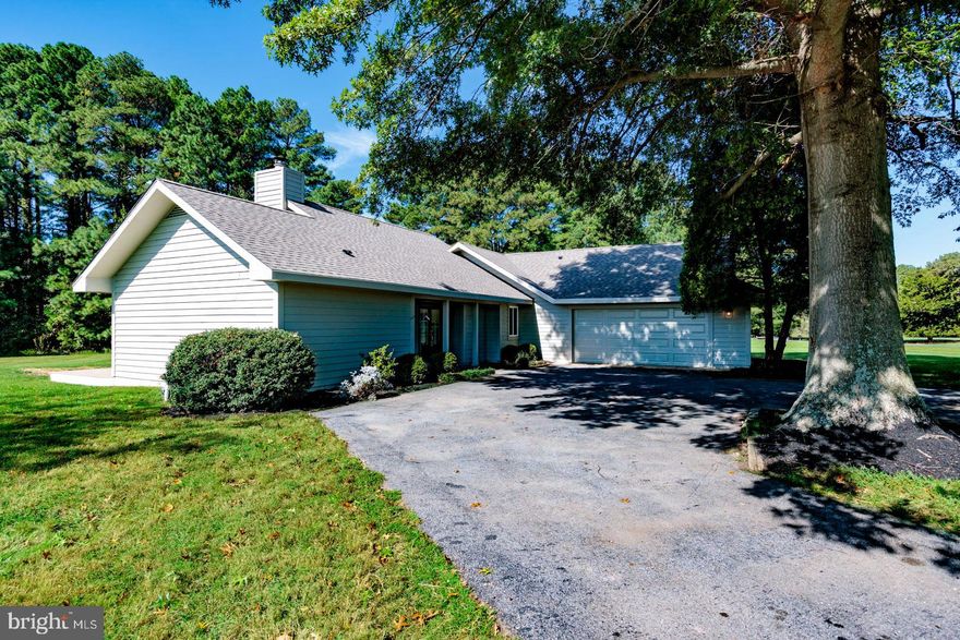 Tucked on a private 1-acre corner lot in the desirable Cove Creek community, this home offers 3 bedrooms, 2 baths, and 1,538 square feet of single-level living. Following a complete renovation, every detail has been refreshed—pairing modern updates with a light-filled open floor plan. Expansive windows and vaulted ceilings create a bright, airy feel, while the family room’s wood-burning fireplace adds warmth and charm. The first-floor primary suite is a true retreat with a spacious walk-in closet and en suite bath featuring a dual-sink vanity. Two additional bedrooms provide flexibility, while a new roof and updated energy systems deliver comfort and efficiency. Outdoor living is equally inviting with a large back deck and porch overlooking mature landscaping, plus a two-car garage for convenience. Residents of Cove Creek enjoy resort-like amenities including an 18-hole golf course, clubhouse, tennis and basketball courts, bocce courts, marina, private beach, exercise facility, and miles of walking trails. Whether as a full-time residence or a weekend retreat, 102 Golf Ct blends the ease of a total renovation with the amenities of a true resort community.
