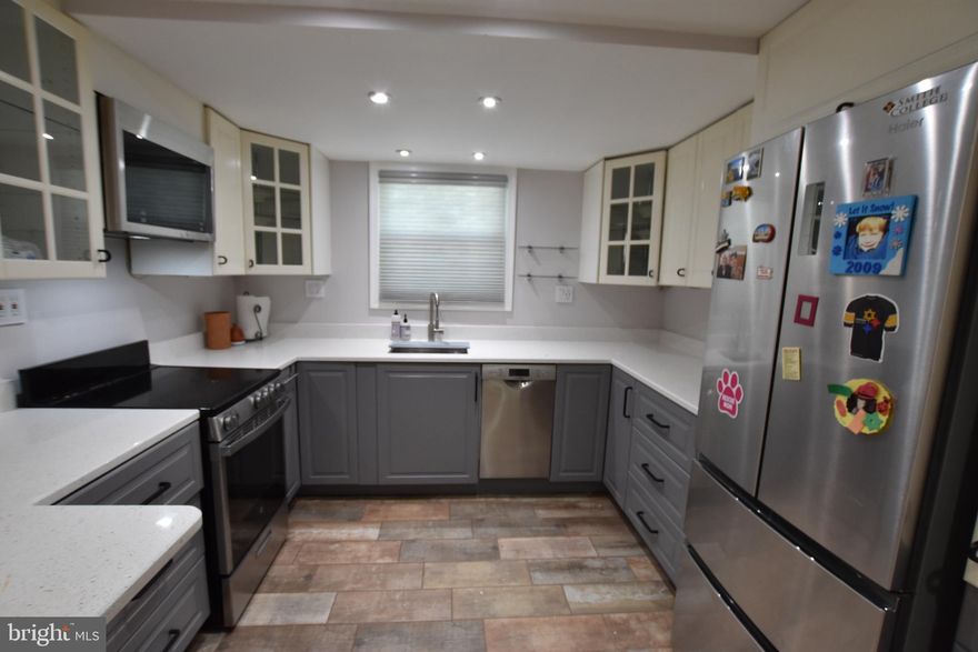 Charming 2BR/1BA ground level condo, fully updated! Hardwood floors, ample closet space, open update kitchen with SS appliances.  One parking space included