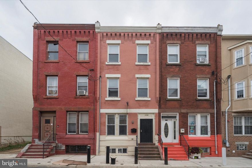 Welcome to 1730 Monument Street, a spacious 6-bedroom, 2-bathroom rowhome located in one of Temple University’s most desirable off-campus housing corridors. This property offers an ideal layout for student housing or group living, making it an excellent opportunity for investors or owner-occupants seeking proximity to campus. The main level features a large open living and dining area with high ceilings, decorative molding, and durable flooring, creating a comfortable space for gathering and everyday living. The eat-in kitchen offers ample cabinetry, generous counter space, and direct access to the private fenced rear patio, providing plenty of outdoor space. Across the upper floors, the home offers six generously sized bedrooms, many featuring hardwood floors, ceiling fans, and abundant natural light. Two full bathrooms provide convenience for shared living arrangements. Additional highlights include in-unit laundry, central heating and cooling, and classic Philadelphia rowhome architectural details throughout the property. Located just minutes from Temple University’s main campus, the property is within walking distance of The Liacouras Center, Polett Walk, Fresh Grocer, SEPTA transit, and numerous restaurants and cafes, making it highly attractive to student renters. With its prime location, large bedroom count, and strong rental demand, 1730 Monument Street presents a compelling opportunity.