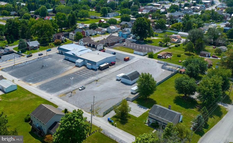 Former L&L Ford dealership in East Berlin for sale .Get your business up and running! 12,000 SF dealership building.  Service shop (Approx. 5,000 SF) includes three lifts with the sale.   Great location - just minutes from PA-234 with ADT of 12,752 cars per day.  Commercial zoning in East Berlin Borough can allow flexible potential for other uses.