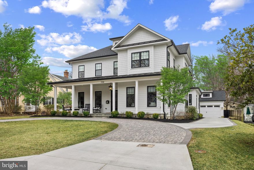 Built in 2021, this exceptional Bethesda residence epitomizes sophistication, elegance, and superior craftsmanship. Spanning over 6,500 square feet —this six-bedroom, five-and-a-half-bath home is designed for both luxurious living and everyday comfort.
 
Situated on a beautifully landscaped 9,800-square-foot lot, the property boasts a circular paver driveway, along with an additional side drive leading to the two-car garage. Every design detail has been thoughtfully selected to enhance both aesthetics and functionality.
 
A welcoming oversized flagstone-tiled front porch with a standing seam roof sets the stage for the home’s exceptional interior featuring soaring 10-foot ceilings, five-inch oak hardwood floors, and custom millwork that create an ambiance of timeless elegance. The open main level is perfect for relaxed living and formal entertaining, featuring a library, formal living and dining room with tray ceiling, a spacious family room, a spectacular gourmet kitchen and huge pantry, mudroom with a pocket office, and a beautifully appointed powder room.
 
The family room, highlighted by a coffered ceiling and a 42-inch gas fireplace, opens to a covered porch with slate tile flooring and a stone wood-burning fireplace—an ideal setting for seamless indoor-outdoor living. The chef’s kitchen is a true showpiece, featuring an oversized island, custom shaker cabinetry with integrated lighting, quartz countertops, a marble backsplash with a pot filler, and top-tier appliances, including a 48-inch Wolf dual-fuel range. A butler’s pantry with wine center, a huge walk-in pantry, and breakfast nook with a built-in banquette further elevate the space.
 
Upstairs, nine-foot ceilings and five-inch oak hardwood floors enhance the home’s refined feel. Four generously sized bedrooms, each with en-suite custom-tiled baths, offer privacy and comfort. The magnificent primary suite is a serene retreat, featuring a tray ceiling, a sitting area with a gas fireplace, and a marble-topped morning bar with built-in refrigerator. The spa-like primary bath boasts gorgeous marble flooring, a walk-in shower with a motion-activated illuminated niche, a soaking tub, dual vanities with marble countertops, and a 200-square-foot custom closet with built-in dressers.
 
The lower level is designed for entertainment and relaxation. Upon entry, a climate-controlled, custom-built 300+ bottle wine cellar sets the tone, followed by an expansive recreation room with a gas fireplace, built-in wet bar with a microwave, dishwasher, and refrigerator, a fifth full bath, and an exercise room with a custom rubber gym floor, two additional spacious bedrooms, plus ample storage.
 
Constructed with the finest materials, the home features Hardie® Plank siding, Andersen windows, August smart locks, a SimpliSafe® security system with video doorbell, a Kohler Alexa-enabled smart mirror, and designer lighting throughout. Smart home enhancements include Hunter Douglas Powerview® motorized blinds in the dining room, living room, and staircase windows, as well as custom blinds and shades in every room.
 
Energy efficiency with dual-zone high-efficiency furnaces and a 75-gallon high-efficiency water heater ensure year-round comfort. The fully fenced backyard provides additional outdoor space, while the side driveway offers extra parking and access to the detached garage.
 
Perfectly positioned, this extraordinary home offers not only luxury and convenience but also a prime location that is walkable to downtown Bethesda with easy access to premier shopping, dining, and top-rated schools