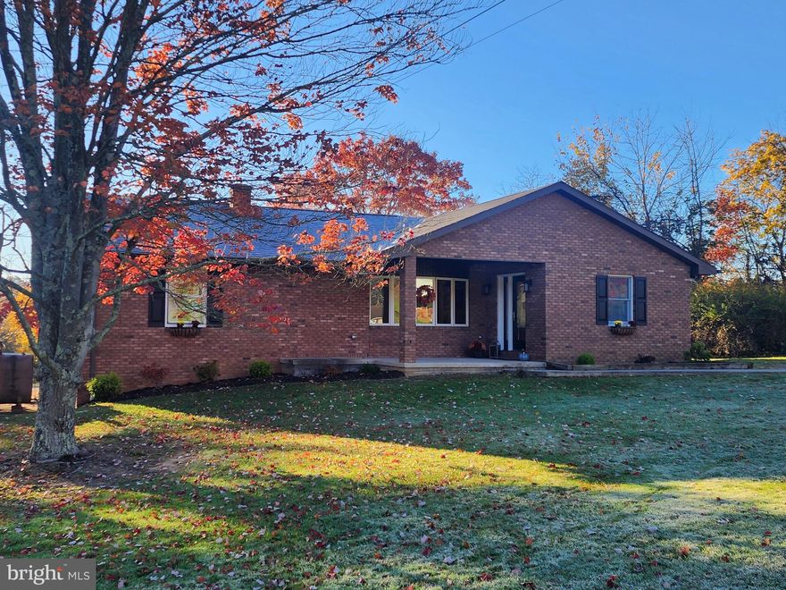 BEAUTIFUL BRICK RANCHER ON OVER ONE ACRE IN A GREAT LOCATION. RECENTLY UPDATED WITH PLENTY OF SQUARE FOOTAGE TO MEET YOUR NEEDS.  THE HOME FEATURES  A CUSTOM KITCHEN WITH QUARTZ COUNTERS, STAINLESS APPLIANCES, AND RECESSED LIGHTING THAT OPENS TO A LARGE DINING/LIVING AREA WITH  VAULTED CEILING. ORIGINAL HARDWOOD FLOORS THROUGHOUT COMPLIMENT SINGLE LEVEL LIVING WITH BEDROOMS, BATHROOMS AND LAUNDRY ON THE MAIN FLOOR. FULLY REMODELED BATHROOMS HAVE BEEN COMPLETED WITH THE UTMOST CARE AND QUALITY.   LOCATED IN THE SMALL MOUNTAIN COMMUNITY OF SHORT GAP WHICH IS MINUTES AWAY FROM ATK AND A SHORT DRIVE TO CUMBERLAND, MD AND I-68.  THE EXTERIOR FEATURES MAINTENANCE FREE BRICK CONSTRUCTION,  LARGE LEVEL YARD, AND A COVERED BACK PATIO.  WHETHER LOOKING FOR A SINGLE LEVEL RETIREMENT STYLE HOME OR A PLACE TO RAISE A FAMILY, THIS ONE WILL CHECK A LOT OF BOXES.  CHECK IT OUT TODAY BEFORE IT IS GONE!