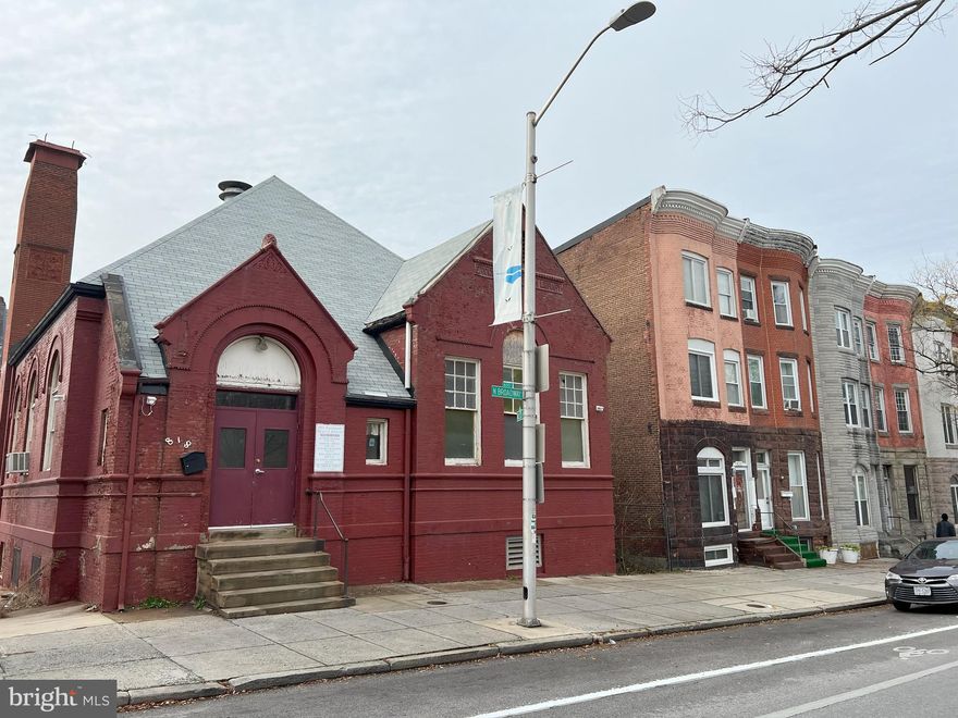 Welcome to a truly unique and historic property nestled in the heart of Baltimore City. This extraordinary space is situated in a Zoned OR-1 district, boasting a distinguished brick exterior that exudes charm and character. Once home to the historic Enoch Pratt Library Branch #5, designed by the renowned architect Charles L. Carson, this building carries an illustrious history that echoes through its very walls.

Upon entering, you are greeted by cathedral ceilings that soar overhead, creating an open and airy ambiance that is both inviting and inspiring. The large windows allow natural light to flood the space, accentuating the architectural details and the history embedded in the rich hardwood floors. Every step you take is a journey through time, as the floor beneath you carries the stories of generations past.

The property comes with board approval for a variety of uses, with a focus on community-centric services. Imagine transforming this space into a vibrant grocery or retail goods establishment, providing the neighborhood with essential products and a unique shopping experience. Maybe you've been looking for your dream home, look no further. Take your creativity and vision and use this amazing space as your canvas to create the dream home you've been looking for. With a new Roof (2020) with 3 bathrooms, and even a kitchen already, you're just a few steps away from your dream home. Large Attic and story and a half brick cottage.

Situated a mere 2 miles from the iconic Inner Harbor, this location is a hub of activity and culture. The property is conveniently located across the street from the renowned Kennedy Krieger Outpatient Center, making it an ideal location for community-oriented services. Additionally, it's just one block from John Hopkins University and Hospital, the Metro, providing easy access for both residents and visitors alike. Take this space and put your creativity and lets continue to create history!