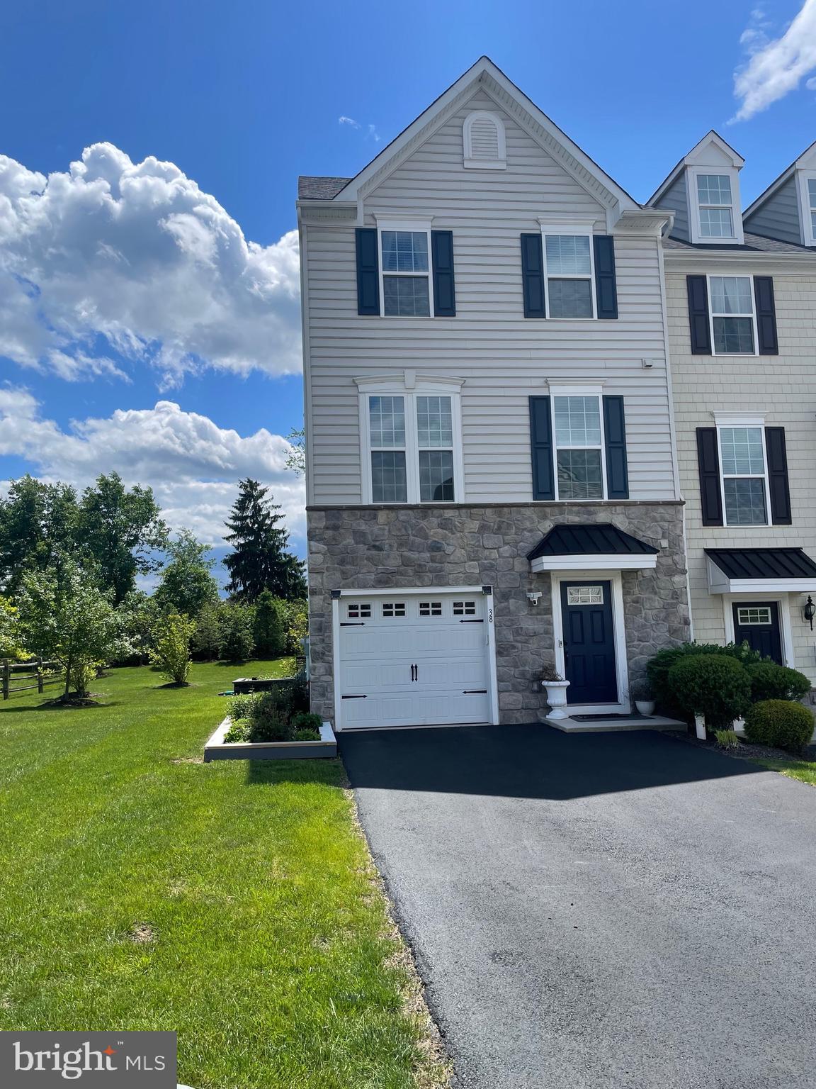 Luxurious End-Unit Townhome with Scenic Views & Exceptional Location – Main Street Crossing: Welcome to this beautifully maintained 3-bedroom, 2.5-bathroom end-unit townhome located in the sought-after Main Street Crossing community. Built in 2017 and offering 2,260 square feet of refined living space, this home is a perfect blend of luxury, comfort, and convenience, nestled in a quiet neighborhood with wooded views. Enter through the garden-level front entrance into a spacious recreation room featuring recessed lighting, upgraded flooring, crown molding, two coat closets, and a massive 6x12 storage closet. An atrium door leads to an extra-large (24x14) concrete patio with modern stone edging and a privacy wall—a perfect setting for outdoor entertaining or peaceful relaxation. The main floor features gleaming hardwood floors and a gourmet kitchen with granite countertops, Energy Star stainless steel appliances, a custom tile backsplash, and an oversized island with seating for four. The kitchen includes a pantry and upgraded cabinetry for ample storage. A sun-drenched morning room with a built-in hutch offers the ideal space for dining or hosting. The great room showcases crown molding, recessed lights, and sliding doors that open to a Trex deck with a privacy wall, offering beautiful green space views and stunning sunrises and sunsets. The primary suite features a tray ceiling, ceiling fan, a walk-in closet, and a luxurious en-suite bath with double sinks, an upgraded vanity, a Jacuzzi soaking tub, and a walk-in shower with bench. Two additional bedrooms share a stylishly tiled hall bath with a tub/shower combo. A second-floor laundry area is equipped with a high-end washer and dryer and extra cabinetry for added convenience. The attached garage offers custom-built 4x8 overhead storage while still allowing room for parking. Enjoy direct interior access and additional storage options throughout. Full privacy and peaceful wooded views make this home a tranquil retreat. Waterworks Park is just a short walk away, offering walking trails, playgrounds, and open fields for sports and outdoor fun. Trappe Center, also within walking distance, features amenities such as a 24/7 gym, karate and dance studios, bounce, dining, and more. A school bus stop which services the top rated Perkiomen Valley School district is located just a short walk from the home—ideal for families..This location is convenient to Rt. 422, Providence Town Center, Wegmans, Ursinus College, and the Schuylkill River Trail.
The unit's total sq.footage is 2,260 SF and it is all above ground.