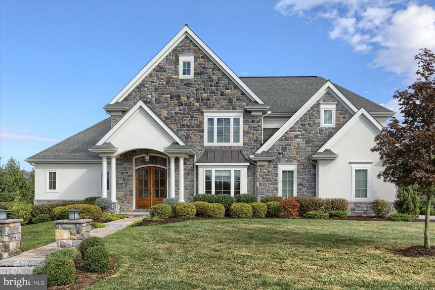 Welcome home to 395 Lake Dr. Pristinely maintained throughout. This stunning Estate showcases 5 bedrooms and 3.5 baths. Impressive two-story entry with wrought iron spindle staircase will impress you from the start. Gleaming hardwood floors throughout the main floor living space. Formal dining room with tray ceiling and an open flow to the kitchen. Gourmet kitchen with stainless steel appliances, quartz countertops, and tile backsplash to ceiling. Countertop seating and breakfast room for eat-in dining. Cozy family room off the kitchen is made for lazy mornings. Expansive two story great room is made for large gatherings. Floor to ceiling stacked stone gas fireplace. Triple transom windows allow for the natural light to stream in. First floor owner suite has been newly upgraded and shows like a model. 5 piece opulent bath with walk in shower, gorgous soaking tub, and floor to ceiling tile surround. Double vanity highlighted with stunning decorative tile wall. 2 walk-in closets. Tray ceiling and views of your tree-lined yard make this the perfect retreat. First floor laundry, mudroom with lockers and closet, powder room with custom glass-beaded wallpaper. Covered porch off the kitchen area will be the spot for many family dinners and quiet nights with a book. Second floor features a private guest suite with its own bathroom and walk-in closet. Three additional spacious bedrooms with a sizeable shared hall bath, plus convenient storage area complete the second floor.  Full basement is unfinished and waiting for your personal touch. It features windows, walk-out patio doors to rear yard, and rough-ins for a full bath plus plenty of space for additional rooms.  Extensive hardscape designed for entertaining out back includes paver patios, gas fire pit and outdoor kitchen complete with built in grill and fridge.  Additional covered seating area all overlooking your private yard. 3 car, side-entry garage. Mechanicsburg School District in sought-after Braeburn Estates, Winding Hills Community. Schedule your private tour today.