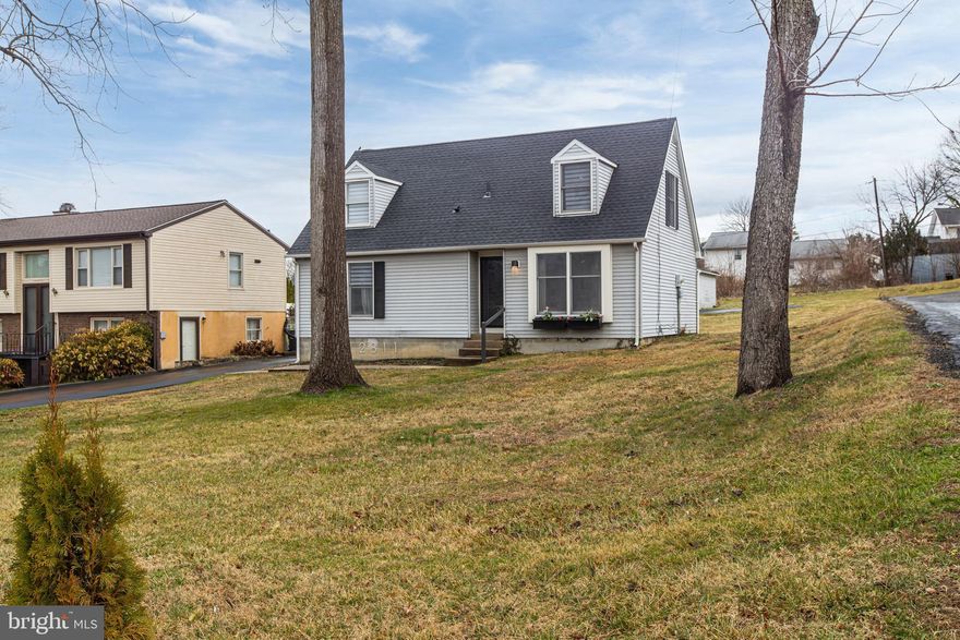 Welcome to this beautifully maintained Cape Cod, ideally located in a prime and convenient area just minutes from Greenville, Hockessin, Pike Creek, major highways, and a variety of shopping and dining options, and nestled near Brandywine Springs Park. This charming three-bedroom, two-full-bath home offers the perfect blend of comfort, style, and functionality. As you enter through the front door, you’re greeted by stunning tile flooring and a modern starburst chandelier that sets the tone for the home’s thoughtful design. The fully renovated eat-in kitchen features white cabinetry, updated appliances, recessed lighting, and continued tile flooring, creating a bright and cohesive space perfect for both everyday living and entertaining. The main level offers a spacious living room with striking black accent walls, an additional statement light fixture, and sliding glass doors that lead to a large deck, ideal for entertaining or enjoying the warmer months outdoors. Also on the main level are two well-proportioned bedrooms, a full bathroom, and a conveniently located stackable washer and dryer in the hallway, newly purchased in 2025. Upstairs, the owner’s suite provides a private retreat complete with a full bathroom and a walk-in closet featuring built-in shelving. This meticulously cared-for home includes numerous updates, including a new roof in 2025, washer and dryer in 2025, fully renovated kitchen and appliances in 2021, recessed lighting added in 2021, and a built-in closet system in 2021. Situated on a generous lot, the property offers ample parking along with a detached garage, providing both convenience and additional storage. This move-in ready home is a true gem in a sought-after location.