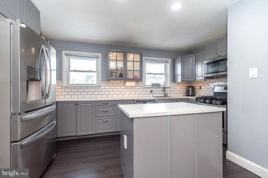 Welcome to this beautifully updated twin located in the highly sought after Roberts Park/Norris Hill Community, known for its friendly atmosphere and welcoming neighborhood feel.  This home offers a perfect blend of modern updates and comfortable living spaces designed for everyday living and entertaining.  Step inside to find luxury vinyl plank flooring throughout the main level and a stunning electric fireplace set within a tiled brick feature wall - a true focal point of the living room that adds warmth and contemporary style.  Upon entering, the living room flows seamlessly into the kitchen, creating an open and inviting layout.  The updated kitchen features abundant cabinetry for storage, sleek quartz like countertops, and all new appliances, creating a space that is both functional and attractive.  There is also a half bath on this floor.  Upstairs, you will find three generously sized bedrooms with plush carpeting, along with a full bath.  The partially finished lower level adds valuable living space, especially with the additional separate room that offers flexibility for a home office, craft room, or bonus room.  The laundry is also located on this level with an outside exit for added convenience.  Enjoy outdoor living in the fenced rear yard, ideal for play equipment, pets, or entertaining guests.  Rear alley drive-through access provides practical off-street convenience.  Close proximity to public transportation, shopping, restaurants, and major access roads truly checks off all the boxes for this move-in ready home in a wonderful community.  Take a look, Fall in love, Make an Offer.