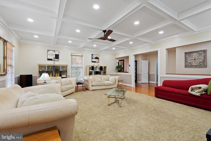 Welcome to this exquisite 2003 stone front colonial home, boasting almost 8,400 square feet of living space spreading across three levels of architectural excellence. With two owner's suites, one conveniently located on then main level and another one on the upper level. As you step inside, you'll be impressed by the incredible inviting setting boasting natural light, nine-foot ceilings trimmed with crown molding on first and lower levels, gleaming hardwood floors throughout the main level, a living room where you can enjoy reading your favorite author, a formal dining room with a powder room on the west side of the home and another powder room on the east side next to the garages. Stunning two level family room with coffered ceilings, wainscots, and dramatic stone fireplace. A fabulous game room with coffered ceilings on this same level, perfect for entertainment. A mud room next to the laundry room takes you to the 3-car garage. The heart of the house welcomes you with an open floor plan. Embrace your inner chef gift and awaken your culinary joy creating memorable gatherings and entertainment to your guests in the amazing kitchen with 42" cabinets, hood, with a huge quartz waterfall island, a second family room/breakfast room with gas fireplace and sliding doors leading to a huge two tier TREX deck. On the upper level, six additional bedrooms including a 2nd owner's suite. The serene owner’s suite offers tray ceilings with accent lights, unfolds a separate sitting area and a luxury bathroom with soaking tub, separate shower and huge walk in closet. The lower level features a restaurant style bar, gym, billiards area, movie room, 8th bedroom , and another flex room for entertaining and walk out through sliding doors.  SEE VIRTUAL TOUR
Extensive $450,000+ renovations. Updates include: Roof (2023), Coffered ceilings (2022), Kitchen renovation (2022), Addition (2010), Well pumps and filtration system (2024), New HVAC (2025).