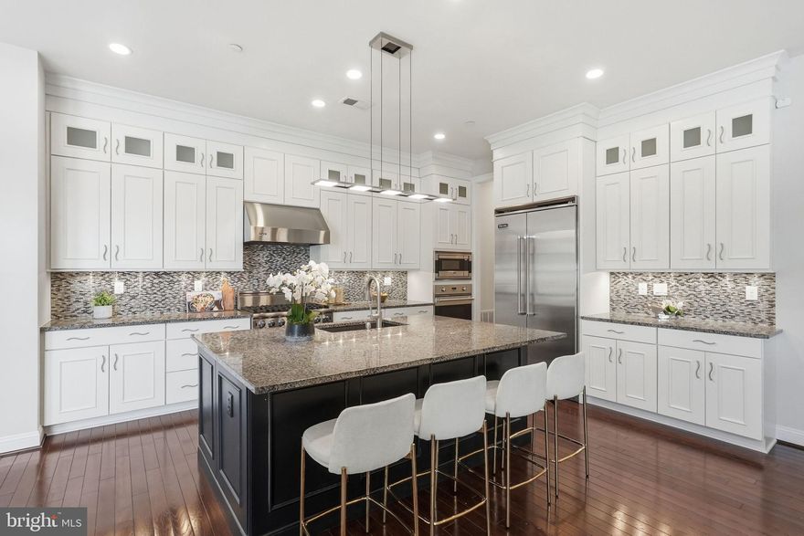 OPEN SUNDAY 4/19 2-4 PM! Exquisite 2017 Colonial by Michael Harris Homes, gracefully sited in the sought-after Bethesda Mews community. Thoughtfully designed with high ceilings and elegant proportions, the home offers a seamless blend of sophistication and comfort. A main-level office and an expansive family room open to the gourmet kitchen create ideal spaces for both refined entertaining and everyday living.

The upper level features four generously sized bedrooms and three beautifully appointed baths, highlighted by a sumptuous primary suite with a private dressing room and a spa-inspired bath complete with steam shower and double vanity. The finished lower level extends the living space with versatile areas for guest accommodations, a fitness studio, recreation, or playroom.

Perfectly positioned near NIH, downtown Bethesda, and major commuter routes, this exceptional residence delivers luxury living with unmatched convenience.