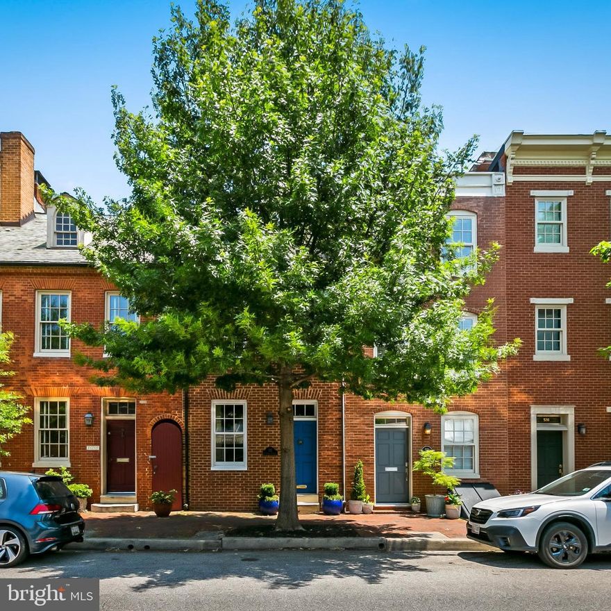 This quintessential city home in the beloved Otterbein neighborhood has been fully renovated while maintaining its historic charm. The main level features a bright living space with tall ceilings and hardwood flooring, a fireplace, a convenient half bath, and a beautifully renovated kitchen. The kitchen features quartz countertops, maple cabinets, stainless steel appliances, and plenty of room for a large dining table. The oversized floor-to-ceiling sliding doors lead to the newly remodeled private brick courtyard, providing plenty of room for entertaining guests. The second level includes two well-sized bedrooms with 10-foot ceilings, a laundry space, a renovated full bathroom, and new closet systems in each bedroom.  The third level is versatile and can be used as an extra living space, a guest suite, or an additional bedroom. It also boasts a sunny rooftop deck and a second full bathroom (it's compact but cute!) The basement of the home provides extra storage. You'll love that you are a short walk to so many amenities and conveniences including coffee shops, restaurants, Camden Yards, M&T Bank Stadium, a neighborhood swim club, and many pocket parks -- while being just a few blocks to the MARC train and Light Rail. Plus, Area 8 Restricted Parking allows for easy permit parking for all Otterbein residents. Avoid the 4+ year wait list . . .membership to the coveted Otterbein swim club conveys with purchase.