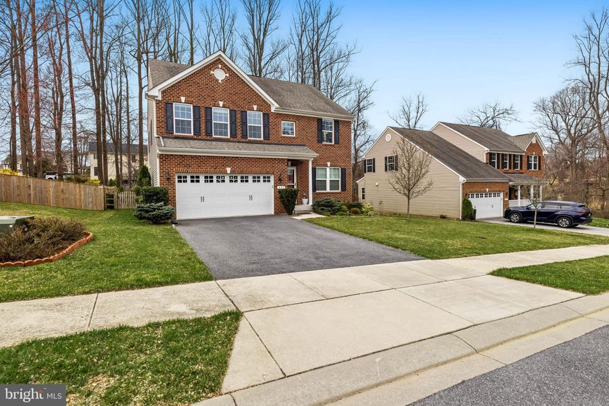 NEW PRICE!!!  Well cared for brick front Colonial with 2 car garage and five bedrooms.  Located on cul-de sac, this home features gleaming wood floors, primary suite includes a full bath with soaking tub, separate shower and double vanity. Main level has formal dining room with vaulted ceiling, living room, open kitchen with granite counter tops and large pantry, screened porch, powder room and family room with fireplace.  Lower level features full bath, rec room and true 5th bedroom.  Fenced rear yard with gazebo, basketball net, rear deck with steps to yard and the list goes on.... Schedule your appointment now.