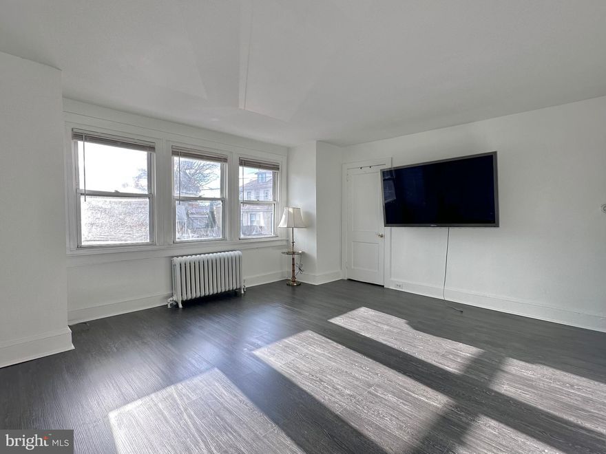 Bright and spacious 2-bedroom apartment in Drexel Hill, freshly updated and move-in ready! This inviting 2nd-floor unit features a freshly painted interior, brand-new flooring throughout, and plenty of closet space for easy organization. The rear kitchen offers a brand-new gas range, built in microwave, large stainless-steel refrigerator, and charming bay windows that fill the space with natural light. The full bathroom includes a tub and connects conveniently to both bedrooms.  Just one block away from Wawa and within walking distance to many great local restaurants and shops. Please note: parking is not permitted in the rear alleyway.  Tenant is responsible for gas, electric, and a flat $25 monthly water fee.