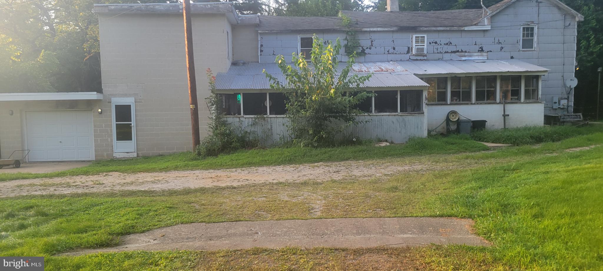 This hidden gem on 2.41 acres in Elkton is the perfect fixer upper for those with vision! With nearly 3,000 sq ft, this 5-bedroom, 1.5-bath farmhouse offers endless potential to restore or renovate. Inside you'll find wood floors, a pellet stove, sunroom, galley kitchen, and double staircases—all filled with character. The walk-up attic and attached garage add even more usable space.
Surrounded by trees and facing Singerly Rd with direct driveway access, the lot offers privacy and room to expand.
Just minutes from Cherry Hill schools and downtown Elkton, this property blends rural charm with convenience. Whether you're a homeowner, investor, or contractor, bring your ideas and breathe new life into this vintage home. Don’t miss your chance to uncover the beauty in this timeless property!