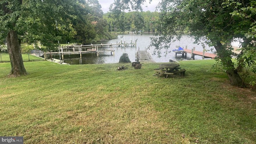 Priced To Sell Fast! Renovate & Resell, Buy & Hold, or Move-In and Build Some Sweat Equity. Rarely Available Water Front Rambler, Spacious Kitchen, Spacious Bedrooms, Deck, .19 Acre Lot, Much More!!  Just Waiting For Your Personal Cosmetics and Updates to Make it Shine. Close to Schools, Shopping and Commuter Routes.  This Will Not Last! Sold As-Is.