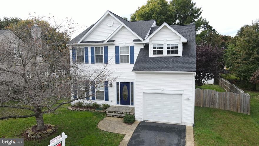 Beautiful 3 Level Colonial with 5 Bedrooms and 3.5 Baths. Main level features hardwood flooring throughout the Foyer, Kitchen with island, breakfast bar, and adjoining breakfast room, as well as the Formal Living Room with custom wainscoting. Family Room has a cozy woodstove for those chilly fall evenings. Upper level has 4 Bedrooms including the Primary Owner's Suite with cathedral ceiling, walk in closet, and attached private bath with separate shower and soaking tub. Laundry is conveniently located on the bedroom level. Finished lower level has a large recreation room, and 5th bedroom and full bath perfect for out of town guests to have their own space! Fully fenced rear yard with large deck and custom patio with firepit area. Storage shed and 1 car attached garage. Conveniently located just off Rt 340 perfect for commuting to work and minutes to downtown Charles Town for shopping and dining!