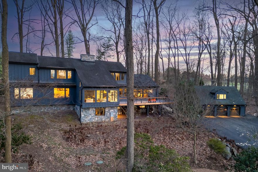 Ready for a one-of-a-kind, custom-built, mid-century modern home sited on 6.6 wooded acres in the heart of Radnor Hunt? Look no further! The woodland setting, a true nature loverś paradise, is easy on the eyes with matured trees, fern gardens and accented by lots of stone walkways. The rear of the property has a large open and flat space affording long views to nearby Kirkwood Preserve, an 83-acre nature and wildlife preserve. This special home offers an abundance of windows allowing unparalleled integration of outdoor and indoor spaces with breathtaking views out of every window. The home features comfortably sized rooms, a highly versatile floor plan and has many on-trend updates resulting in a rustic, yet modern aesthetic and instills a sense of care-free living. Hallmarks include expansive deck overlooking the grounds, remarkable fireside Living Room with soaring ceilings, Kitchen opening to adjacent Family Room, Dining Room, Mudroom (with large pantry and powder room) complete the day-to-day living spaces. Additionally the main level features an inviting entry foyer and three bedrooms which can also accommodate a home office(s) and neutral hall bath and an amazing Laundry Room. Ascend open and turned staircase with an oversized window to the second floor with an open hall. Primary Bedroom Suite is comfortable and opens to a Dressing Area, features a spa-like Bath with large stall shower, double-bowl vanity, soaking tub, water closet and two outfitted, walk-in-closets. The second floor also features two additional rooms which can be used for any number of purposes. Newly refinished daylight/walk-out lower level offers a large Recreational/Media Room, highlighted by a sleek wet bar, and convenient beverage refrigerator. Powder room and secondary laundry complete this floor. Property features a large detached three-car garage with climatized space above, currently used as an at-home gym but could be used for any number of purposes. Lots of recent capital improvements have been made to this home including: energy-efficient geothermal heating, comprehensive well and water treatment systems, newer driveway, two newer hot water heaters and oversized newer on-site septic system to name a few. Enjoy the benefits of award-winning Great Valley School District and notably low taxes,, $12,046! The home is located close to Radnor Hunt Pony Club, a host of private clubs, private schools, and an abundance of shopping and dining destinations along Main Line, the downtown areas of Malvern, West Chester and Newtown Square. Easy commuting to Philadelphia International Airport (less than 30 minutes) and nearby Paoli Train Station offering SEPTA rail service for commuting to Center City as well as AMTRAK Service to NYC, D.C. and points beyond.  A truly unbeatable town & country lifestyle awaits the next lucky buyer.