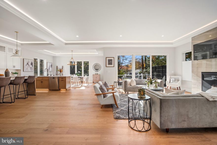 OPEN HOUSE SUNDAY 2/15  FROM 1 to 3 PM . Gorgeous home with 6 Bedrooms, 6 Bathrooms and 2 Half Baths in the prestigious McLean Hamlet! Ready to move in! Exquisite open concept living redefined in this sleek and sophisticated modern design by Bella Home Construction boasting  over 7300 square feet of three finished levels on a beautifully landscaped 0.37-acre lot. Short walk to Spring Hill Elementary school and quick access to the Silver Line Metro and bus routes.

This home is beautifully designed for both everyday living and grand entertaining.  From the moment you arrive, a charming front porch welcomes you into a dramatic, light-filled open layout featuring 7.5” wide European oak floors, 6" Baseboard, 10 ft ceilings on the main level, 9 ft upper level and lower level. Rich wood accent walls add warmth and texture throughout. 

The main level boasts an expansive family room with tray ceilings and LED lighting, gas fireplace and it opens to a gourmet chef’s dream kitchen, complete with a oversized quartz island, luxury top-of-the-line stainless steel Jenn-Air appliances, under cabinet and floor lights, butlers pantry and a walk-in pantry. Entertain in the elegant formal dining room, complemented by a versatile office or guest suite with a full bath. The bright breakfast area flows effortlessly into the family room and out to the deck, creating the perfect setting for indoor-outdoor gatherings. A stylish mudroom and a doggie spa bath center—accessible from both the kitchen and the garage—enhance the home’s thoughtful design.

On the upper level retreat, the lavish primary suite is a true sanctuary with heated floor in the spa bath, a spectacular 2-person rain shower, a free standing oversized 72” soaking tub , double vanities, a dedicated makeup area and 2 oversized custom walk-in closet. Three additional bedrooms, each featuring a private en-suite bath and generous closet space, provide the perfect blend of comfort and sophistication.  A spacious, dedicated upper-level laundry room is equipped with a front-loading washer and steam-sanitize dryer.

The lower level utilizes the open floor plan to maximize living space and functionality, with a bedroom suite, large recreation room, wet bar and wine cooler, theater, studio/gym and additional half bath. The gas fireplace is an extra added bonus for those cold winter months. 2 car garage and a 240V electric vehicle charging outlet. . Home is located minutes away Tysons Corner Center, Tysons Galleria, Capital One Hall, Wolf Trap, Great Falls National Park, and many more. Located inside the beltway with access to I-495, Route 7, Route 123 and Dulles Toll Road.