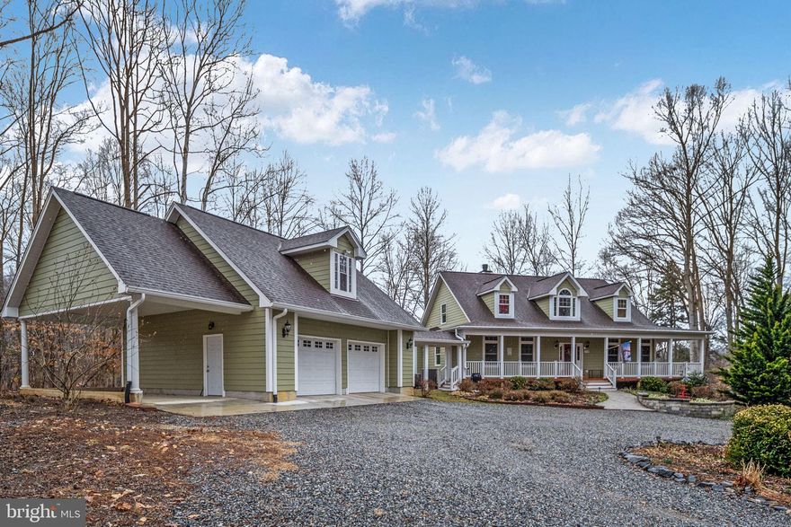 Welcome to3900 Water Front Court on the Public (cold) Side of Lake anna.  Located in Sycamore Shoals.  A medium density community with large lots and plenty of old growth trees.

Home is located on a quiet cul-de-sac.  Follow the driveway up and around the circular drive to arrive at the house.  Plenty of parking and easy and access to the garage.  A beautiful Cape Cod style house with a covered wrap around porch and a simi detached garage that joins the house by a covered walkway.  This home has wonderful flow from one room to the next for easy movement through the house.  

Home features new carpet on the first level and freshly painted.   High ceilings and a wall of windows facing the lake greet you when you enter the home.  A main level primary bedroom with ensuite has double vanities, a soaking tub, and a walk in shower.  Full bath on each level, 2 of which are on the main level.  2 bedrooms and a bath on the upper level.   Kitchen has a gas stove and a double oven. One gas fireplace, one wood burning fireplace.  Living room, den/guest room, dining room, eat in kitchen, family room with wet bar and a large storage room.  The lower level is walkout to grade.  New carpet on the main level.   2 water heaters and 2 HVAC systems.  The 2nd of each can be turned off at the breaker when demand is low.  
The oversize garage features 2 parking spaces inside and a carport outside.  There is an unfinished space above the garage that is accessed by the inside staircase.
There is an adorable potting shed in the back yard.  Ample room for a mower, tools, and planting supplies.  
Down to the water the shoreline has been left natural.  The boat house has 2 slips.  Each has an electric lift.  The boathouse has a locking storage closet, screened porch and a large deck that covered as well as an uncovered portion for soaking up the sun.
The homeowner is an avid gardener, so the yard has been planted with native perennial plants that fill the yard with color all spring and summer long and for each year to come

This property offers calm waters in a quiet cove with the main lake right around the corner.

Don’t miss out on your chance to call this beautiful home  yours.