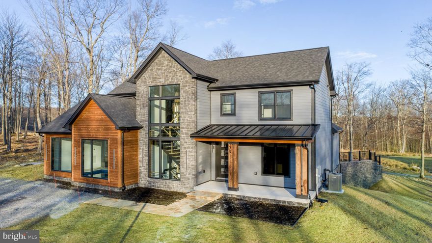 Luxury Living and Elegant Lifestyles have met on Lodestone Golf Hole #1 !!  This charming Contemporary 6- BR Custom- Built home w/ Indoor Pool will exceed  your expectations. Offered fully furnished ready to occupy. Kisamore Enterprises, LLC  from Morgantown, WV have pulled out the stops on this one. Three full levels totaling 5,800 square feet of finished living area with multiple family gathering spaces  and outdoor covered deck overlooking Hole #1 tee box.  The opportunity to take ownership during the construction phase is yours for the taking. Photos will be updated during construction, but don't wait to long on this one. It is a winner. Vacation Rental potential of $160,000+ utilizing all the home  Amenities & Lodestone Location.