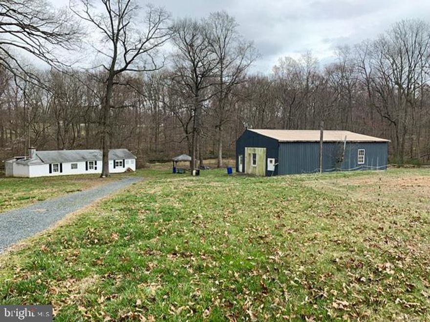 Endless possibilities! Looking for your own private retreat? Build your dream home, farm, hunting lodge or nature preserve on this beautifully secluded 8 acre parcel with stream, pond, woods, meadows and wildlife galore! Previously used for recreation by the Raccoon Club of MD, property includes well, pole barn with electric service & large block building with kitchen, electric and septic, plus previous mobile home site with its own electric and septic- offering many options to suit your plans. Bring your fishing rod, horses, green thumb, and get away from it all! Check with Harford County on possible uses. Property being sold AS IS.