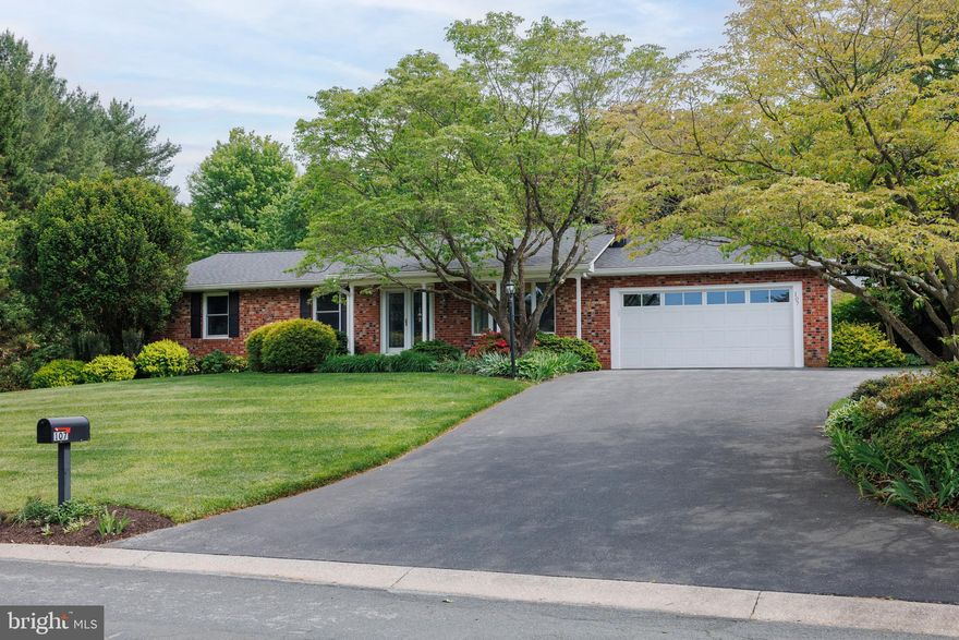 OPEN HOUSE SATURDAY, MAY 16 FROM 1-3! Welcome home to this charming & spacious rancher situated on a picturesque .58-acre lot with thoughtful upgrades and special features throughout. This home showcases a stunning family room and breakfast room addition with soaring cathedral ceilings, along with a beautifully updated kitchen and updated baths. Hardwood floors flow through the main living areas, including the living room with a wood-burning fireplace, formal dining room and three generously sized bedrooms. The primary bedroom offers a private bath, creating a comfortable space. The huge finished lower level provides an expansive rec room plus laundry, storage, walkout stairs and a half bath.  Outside, enjoy the inviting welcoming front porch, extra deep 2-car garage, and a spectacular backyard featuring a large paver patio, lush landscaping, berry & vegetable gardens and plenty of room to relax or entertain. Located just minutes from Piney Run Park—with boating, fishing, kayaking, hiking, and more—plus close proximity to restaurants, shopping, medical offices, and major routes, this home offers the perfect blend of comfort, space and location!