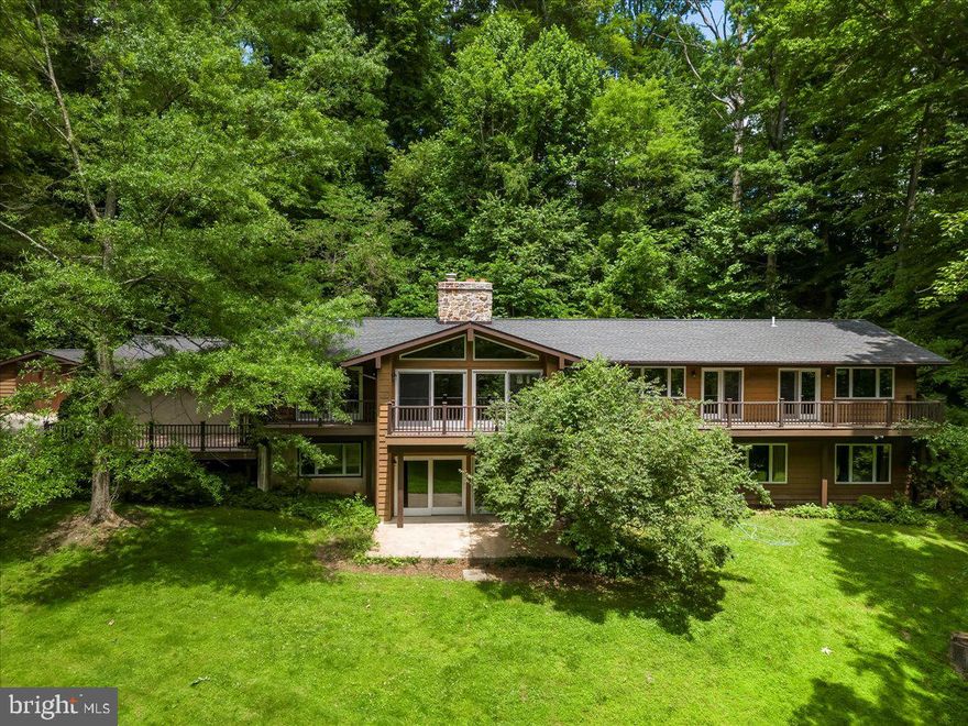 Get ready for this hidden gem within minutes to everything!  Welcome to 1012 Garrett Mill, this home was completely rebuilt in 2018.  Situated near Okehocking Preserve you will travel down the long private drive to your future oasis.  Do not be fooled when you arrive, this house has everything you ever wanted.  Enter to main floor and notice the natural light.  Make your way right into the large great room with vaulted ceilings, stone fireplace and sliders to deck overlooking the expansive yard and pond.  The gleaming hardwood floors guide you on your tour which continues to the dining room where you can access the large composite deck, ideal for summer cookouts.  The Kitchen checks the boxes for the most discerning chef, center island, farm sink, double ovens and granite countertops.  The eat in breakfast area completes the kitchen.  Making your way back through the foyer you will stumble upon one of two laundry rooms and a massive home office or second entertainment space with access to private deck.  A few more steps and you will enter the primary suite with amazing views, huge walk in closet and bathroom to envy.  Massive walk in shower, double vanities and storage.  A large powder room completes this level.  Make your way down the open staircase to discover a large family area with sliders to the rear patio and yard.  A second office, playroom or workout room awaits you just off the family room.  Continue your tour to discover a beautifully appointed full bathroom.  3 large bedrooms are on this level as well as another updated bathroom with tub and shower.  The second laundry room makes this a not so awful task.  A connected two car garage as well as detached garage supply plenty of room to store all your toys.  The house is protected by a new roof in 2018, a Geothermal heating and cooling system, new windows in 2018, new plumbing, and new electric in 2018.  New well pump keeps the fresh water flowing and brand new hot water heater keeps it hot.  All of this, plus 5.5 acres of private, tranquil, pond viewing delight.  Schedule your private tour today!