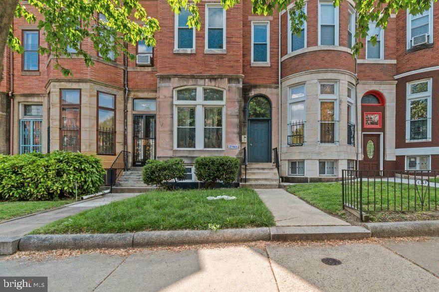 ● Two blocks from Johns Hopkins University with JH shuttle stop at the end of the block – ensures consistent rental demand from students, faculty, and medical professionals.
●Four 1-bedroom apartments – oversized layouts appeal to long-term tenants and support above-average rents.
● Fully renovated with spectacular kitchens, bathrooms, wood floors and laundry – desirable finishes attract quality tenants and reduce turnover.
● Located in one of Baltimore’s most stable rental submarkets – strong tenant demand fuels dependable occupancy and long-term appreciation potential.
2740 Saint Paul Interiors:
Each of the four fully renovated one-bedroom apartments at 2740 Saint Paul is thoughtfully laid out to maximize space and function. The building underwent a full gut-to-studs renovation in 2017. At approximately 17 feet wide by 80 feet deep, each apartment offers a generous footprint with a practical, well-balanced layout.

Apartments 1, 2, and 3 have hardwood floors throughout the living spaces, while the terrace apartment features vinyl plank flooring. All kitchens are outfitted with granite countertops, real wood cabinets, stainless steel sinks, dishwashers, and 30″ electric ranges with ceramic cooktops. Bathrooms feature steel tubs, modern vanities, and ceramic tile tub surrounds and flooring. Three apartments are equipped with stacked washers and dryers, and the terrace unit includes a full-sized washer and dryer. Select units also feature exposed brick.

Utilities:
This all-electric building has been overhauled with a full sprinkler system and upgraded 400-amp electric service.  Each apartment has its own electric heat pump with central air, as well as a 40-gallon electric water heater. The building is separately metered for electric with five total meters. Leases are currently structured so that each tenant pays $35/month toward the water and sewer bill. An additional opportunity exists to lease the two rear parking spaces at $50 per month each.

All-electric mechanicals not only simplify operations but also align with growing demand for sustainable housing. With no gas lines to maintain or convert, the building is already compliant with potential future energy regulations.

What’s Great About Charles Village?
Located just two blocks from Johns Hopkins University and Wyman Park, 2740 Saint Paul sits in the heart of Charles Village—one of Baltimore’s most walkable and well-served rental neighborhoods. A Johns Hopkins shuttle stop is located right at the end of the block, offering tenants direct, no-transfer access to both the Homewood and hospital campuses. The building is also four blocks from the Charles Village Shopping District, home to national retailers like Starbucks, Chipotle, and Barnes & Noble, along with a grocery store and other everyday conveniences. The property lies within the Charles Village Community Benefits District, which provides supplemental sanitation, private security patrols, and neighborhood events—adding to the area’s appeal for students, faculty, and professionals alike.