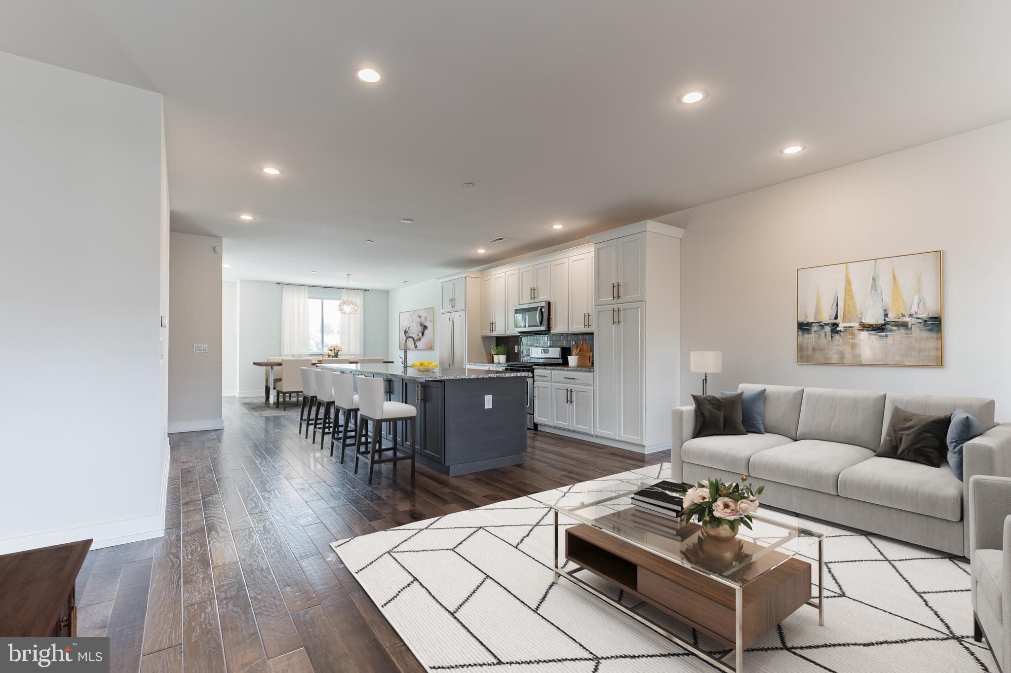 Welcome home to this luxury townhome located in the Brownstones at the Village at Valley Forge! This Dalbar model by Toll Brothers is three bedroom, two and one-half bathroom providing an open floorplan that includes elegant hardwood flooring, tons of natural light, a gourmet kitchen with a large center island, 42-inch cabinets, tons of counter space, stainless steel appliances, and granite countertops. The primary suite has its own private balcony along with a generously sized walk-in closet, spacious tiled master bath with two vanities, a stand-up shower, and an ample-sized linen closet for all of your personal needs. Two more bedrooms, one with 11.5-foot ceilings, a hallway bath and a conveniently located laundry finish off the upper level. The amazing rooftop deck with unobstructed views is perfect for stargazing or entertaining! An attached garage with additional off-street parking contributes to the luxury and low-maintenance living. Located within walking distance to the King of Prussia Town Center which boasts a variety of restaurants, shopping, fitness centers, and entertainment. Close to major roadways and public transportation as well as being in the highly acclaimed Upper Merion School District make this home's location a huge plus! This home is ready for its new owner to move right in.  Please take a look at the Virtual Tour!!
