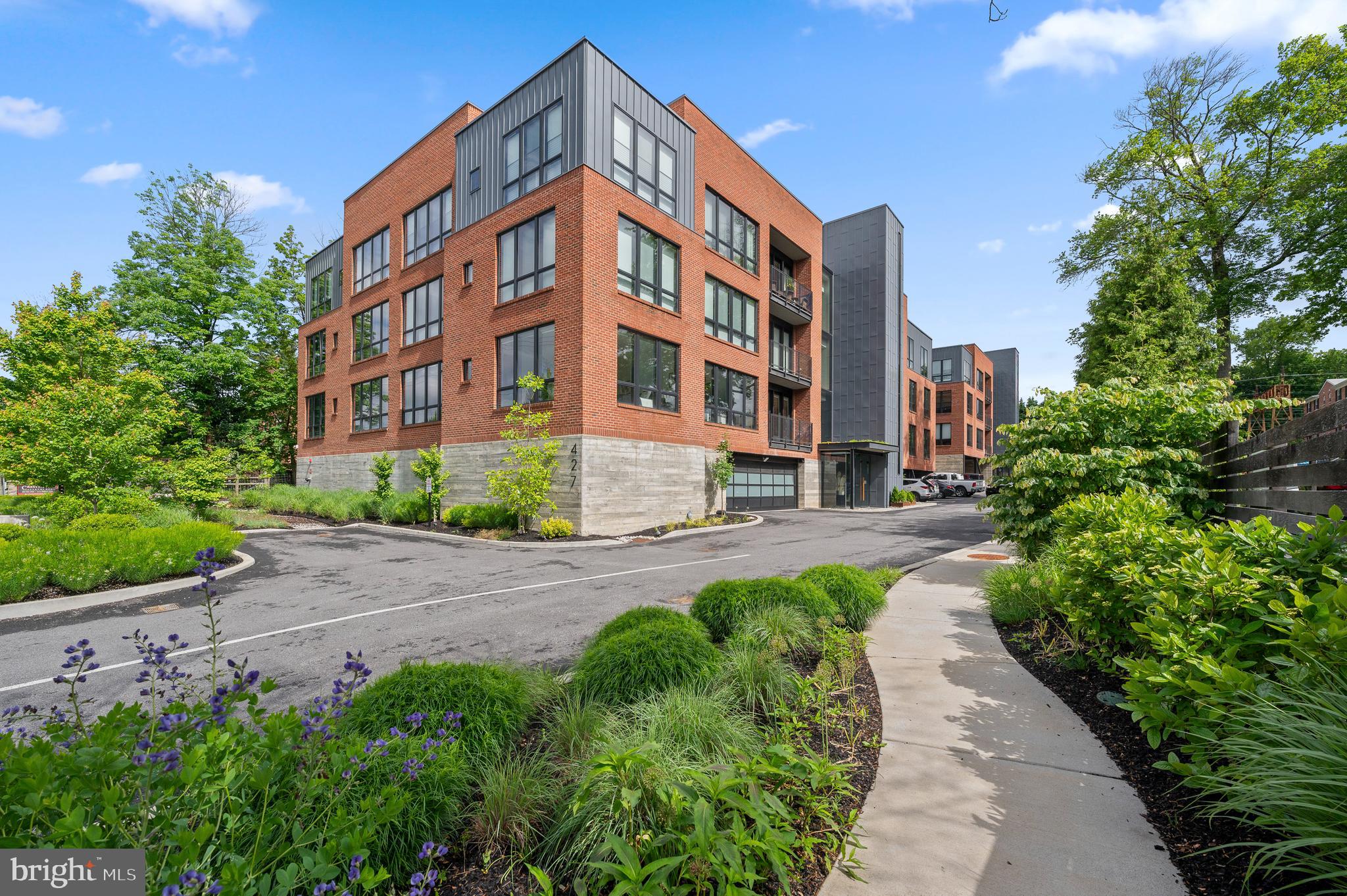Welcome to luxurious condo one-level living at 427 E Lancaster Ave in the historic town of Wayne, PA. This spacious residence offers 1,882 square feet of sophisticated living space, featuring two bedrooms and two and a half bathrooms. Ideally located near boutiques and an array of shops, dining experiences, parks/trails, and convenient to the train station.
The open floor plan is designed to enhance both entertaining and everyday living. The spacious living area is filled with abundant natural light and features hardwood flooring, complemented by high-end modern finishes. The contemporary kitchen is a culinary enthusiast’s dream, equipped with premium appliances and a large island topped with quartz counters.
Retreat to the primary bedroom, which offers a private ensuite bathroom and large walk-in closet, perfectly designed for relaxation and tranquility. The additional bedroom, with ensuite bathroom, is equally spacious and provides comfort and privacy for guests or can be utilized as a home office.
Convenient parking with 2 underground parking spaces in a secure garage with keyless entry.
This residence is part of a community that prioritizes ease and modern living, featuring amenities such as a gym, garden courtyard, and in-unit laundry, all designed to complement your lifestyle. Secure your opportunity to enjoy the perfect blend of convenience and luxury.