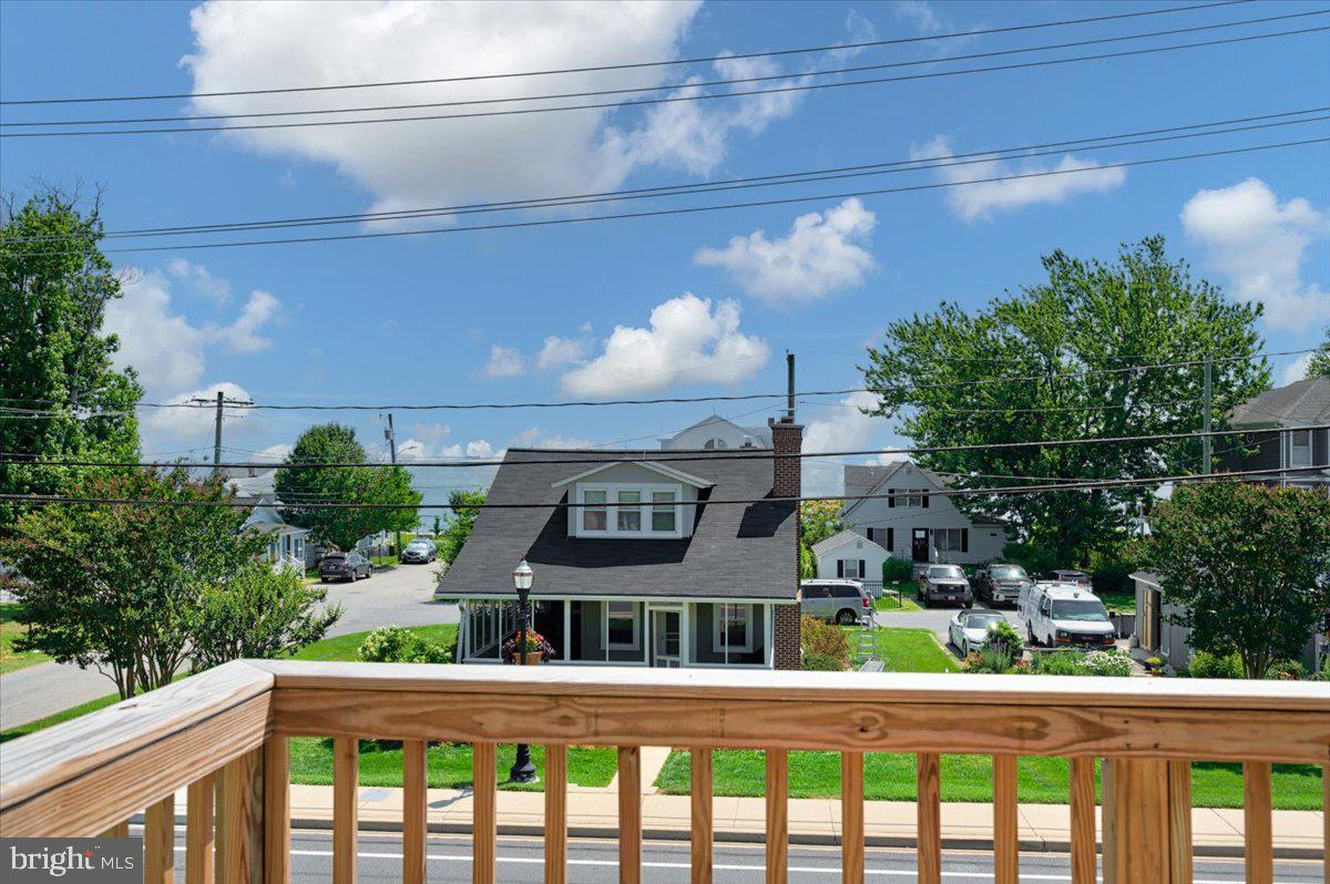 The perfect beach getaway! Nestled in the heart of Chesapeake Beach, this expansive residence offers an unparalleled opportunity to embrace coastal living at its finest. Imagine starting your day with a breathtaking sunrise from your water view balcony, as it rises over the Chesapeake Bay, followed by a leisurely stroll to the vibrant boardwalk of North Beach. Then end your day on the wonderful screened porch. Spend winter evenings by your gas fireplace. This is more than a home; it's a lifestyle, with the best of both Chesapeake Beach and North Beach, just a short walk from your front door. From the sun-drenched beaches and charming local shops to the delectable dining and lively community events, everything you desire is within easy reach.
A Canvas of Endless Possibilities! Outside you can enjoy the fenced-in yard. Step inside and discover a home brimming with potential. Boasting four exceptionally large bedrooms and two full bathrooms, this residence offers an abundance of space for family, guests, and all your needs. A dedicated office provides the perfect environment for remote work or quiet study. The heart of the home is the extra-large kitchen, where your culinary inspirations can come alive. Let's not forget the manicured landscaping and home generator for extra convenience. The upper level deck, with water views, was replaced just 2 years ago, along with the doors.
One of the most unique features of this property is the separate auxiliary building. Currently housing a hot tub, this versatile space can be transformed into a luxurious private spa, a productive workshop, a secluded office, or anything your heart desires. Your she shed or man cave (or both) awaits.
Awaiting your personal touch, this beloved home, offered as an estate sale and sold "as is," presents a remarkable opportunity to create your dream beach house. The solid foundation and exceptional layout provide the perfect framework for a spectacular transformation. Modern conveniences are already in place, including an elevator for easy access to all levels and a newer, 1-year old, HVAC system, ensuring your comfort for years to come. This home is in excellent condition and well cared for.
Ample parking is a rare find at the beach, and this property delivers with an oversized, two-car garage and additional space for four more vehicles, making it ideal for entertaining. This is a rare chance to own a home of this magnitude in such a coveted location with views of the Chesapeake Bay. Embrace the opportunity to infuse your personal style and create a truly magnificent coastal retreat.