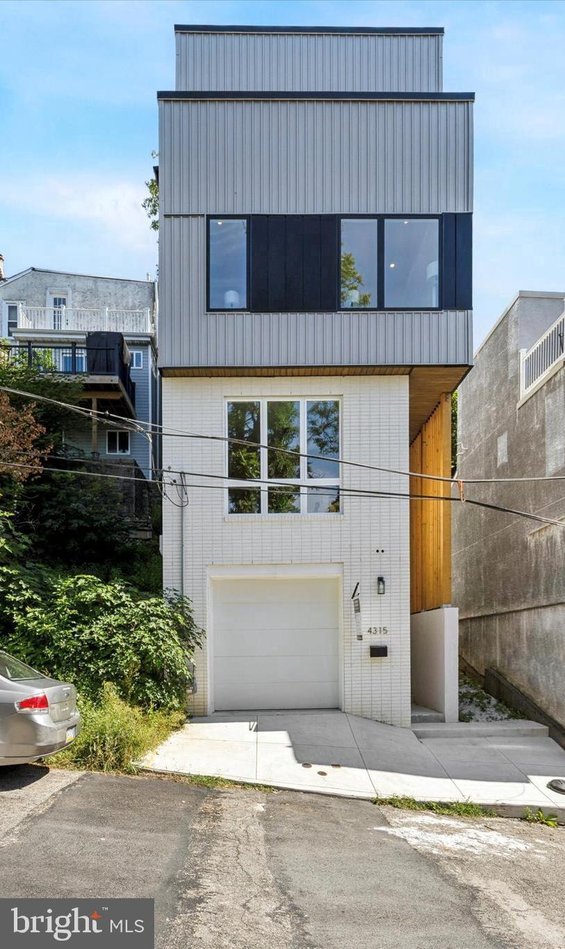 Welcome to 4315 Boone Street, a meticulously crafted, new construction home in the heart of Manayunk. Perfectly situated on a large 32 x 70 foot lot this luxury townhome offers an expansive & functional design, w/over 3,500+ square feet of thoughtfully crafted living space. Boasting 3 spacious bedrooms and 3.5 modern bathrooms, it’s perfect for comfortable, easy living and entertaining. The open-concept floor plan flows seamlessly throughout, with an abundance of windows offering an incredible glass to square foot ratio for natural light. One of the standout features of this home is the stunning roof deck, providing breathtaking views of the city and a perfect space for relaxing or hosting guests. Additionally, the home includes an oversized 1 car garage for convenient parking and several other private outdoor spaces, allowing you to enjoy outdoor living at every turn. This home is ideally located, just a short stroll to Manayunk’s Main Street with vibrant and trendy bars, restaurants, and shops. You’ll also appreciate the easy access to Center City Philadelphia, just a quick drive away. For those who enjoy outdoor activities, a family-friendly park is just one block from your doorstep, providing an excellent spot for recreation and relaxation. Designed by the renowned Morrissey Design Group, this home draws inspiration from Scandinavian design principles, focusing on clean lines, simplicity, and functionality. For your peace of mind, this property comes with a 1-year builder’s warranty and is approved for a 10-year tax abatement. Don't miss out on the opportunity to own this exceptional home in one of Philadelphia’s most sought-after neighborhoods!
