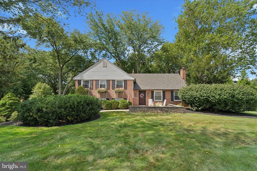 Welcome to 131 Brookmead Road, a meticulously maintained brick colonial in Wayne. This move-in ready home combines timeless character with thoughtful updates throughout.
Inside, refinished hardwood floors and custom millwork set the tone. The professionally designed kitchen features custom cabinetry, soapstone countertops, and built-in Wolf range with hood, Viking refrigerator, Viking dishwasher, under-counter microwave, and wine cooler. Ample storage ensures everyday convenience.
The bathrooms have been fully renovated, including a primary suite with Carrara marble finishes, double sinks, rain-head shower, and custom cabinetry.
Four well-appointed bedrooms provide versatility. One was featured in Better Homes & Gardens Magazine for its distinctive design, while another functions as a loft space with built-ins, skylight, and walk-in closet, ideal for an office or guest room.
Distinctive design details include reclaimed Lancaster County barnwood, used for the powder room vanity, loft bench, closet door, and the mantel above the outdoor fireplace.
The lower level offers a waterproofed basement with French drain, sump pump, sealed walls, and updated electrical outlets.
Outdoor living is a highlight: a covered flagstone patio with vaulted ceiling, fireplace, outdoor kitchen, and landscaped yard bordered by mature plantings and canopied trees — one of the features that first drew the sellers to the property. The level backyard offers potential for a pool or other additions.
This property is conveniently located near downtown Wayne, King of Prussia, and major routes including 202 and the PA Turnpike. Valley Forge National Park is within walking distance, and the home is served by the Tredyffrin–Easttown School District. The listed above-grade square footage of 1,677 is incorrect. According to recent  measurements Alcove Media the above-grade living area is 2,317 sq. ft. The below-grade space is 1,244 sq. ft., for a total of 3,561 sq. ft