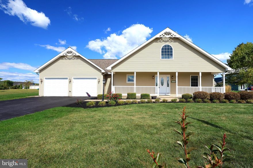 Surrounded by rolling farm fields & unobstructed mountain views, this sprawling ranch rests gracefully on 0.82 scenic acres of peace & tranquility. A full-length covered front porch sets the tone, welcoming you home & inviting you to slow down & savor the professionally landscaped setting.  Step inside to a soaring cathedral ceiling & gleaming hardwood flooring that stretch across the open-concept layout. The foyer flows effortlessly into the great room, where a dramatic floor-to-ceiling stone fireplace anchors the space & creates a cozy focal point for gatherings. Whether hosting friends or enjoying a quiet evening, this home offers the perfect blend of spaciousness & serenity. French doors lead to a covered rear porch overlooking the picturesque backyard.  The kitchen features solid wood cabinetry, ceramic tile flooring & backsplash, a generous pantry & a charming breakfast bar ideal morning coffee or casual bites. A delightful dining area provides the perfect setting for upcoming holiday meals & everyday enjoyment.  The primary suite is a must-see retreat, showcasing a trey ceiling, a spacious walk-in closet, a private full bath with tile flooring, dual vanity, soaking tub & walk-in shower. Two additional bedrooms & another full bathroom offer comfort & flexibility.  You'll love the convenience of the main floor laundry/mudroom, which leads directly to the oversized heated 2-car garage. The full unfinished basement offers abundant storage & includes a Bilco door for easy outdoor access.  Additional amenities include energy-efficient geothermal heating & cooling, active radon mitigation, water softener system & a 12x20 shed.  Set in a peaceful country location just 6 miles from Bellefonte, within 4 miles of I-99 for easy access to State College & Penn State University & a scenic 21-mile drive to Lock Haven University, this exceptionally maintained property offers the perfect combination of tranquility & convenience.