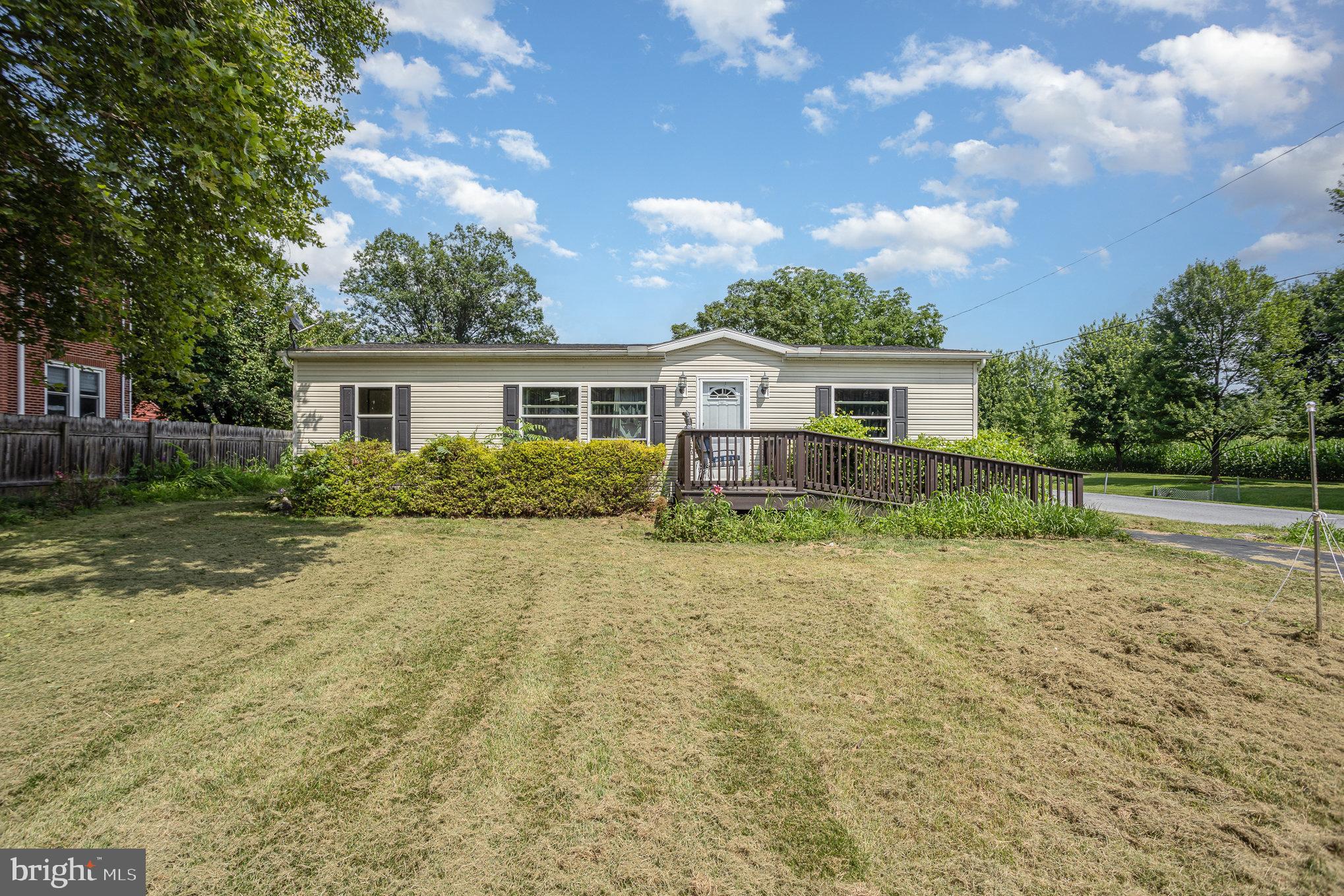 Welcome to this charming and accessible 3-bedroom, 2-bathroom ranch-style manufactured home located in desirable Derry Township, Hummelstown, PA. Built in 2012 and meticulously maintained, this 1,056 sq ft one-level home offers comfortable and efficient living with thoughtful touches throughout. As you step inside, you'll be greeted by a spacious and open layout designed for easy living. The main level features all three bedrooms and two full bathrooms, offering convenience for everyone. The home is equipped with central air conditioning and forced air heating powered by natural gas, ensuring year-round comfort.
With handicap accessibility including a ramp to the front entrance, this home offers inclusive features not often found at this price point. The property sits on a generous 8,712 sq ft lot and provides ample off-street parking with space for four vehicles. No basement, no fireplace, and a low-maintenance slab foundation make upkeep a breeze. Whether you're a first-time buyer, downsizing, or looking for a single-story lifestyle, this move-in-ready gem offers flexibility and function.
Located in a peaceful residential neighborhood with NO HOA, this home is connected to public water and sewer and features an electric water heater. With a frame construction and classic ranch/rambler design, the home blends comfort and simplicity in a great location. Don’t miss this rare opportunity to own an affordable, accessible, and well-cared-for home in one of Central PA’s most sought-after communities.