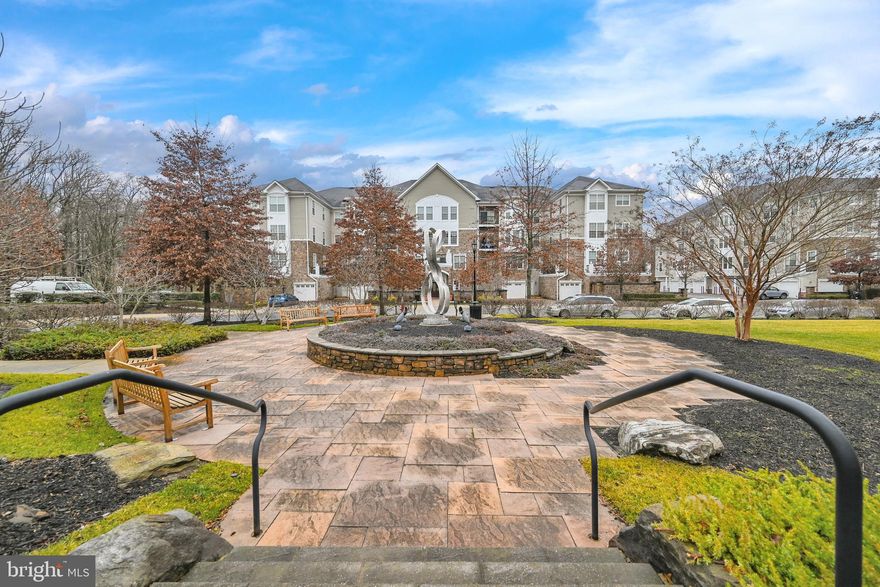 Located in The Quarry Lake at Greenspring,  a gated secure Travertine community, this beautiful 3rd floor unit with spectacular water views, is lovingly maintained and ready for you to call home. Offering two bedrooms and 2 full bathrooms along with a den and a breakfast room, this floor plan is one of the largest available. The kitchen boasts granite countertops, stainless steel appliances and gorgeous cabinetry. The living and dining rooms are open concept and offer ample space for entertaining friends and family. The primary bedroom offers a sitting area. Perfect for relaxing.  Both bedrooms are complete with walk-in closets. Hardwood floors and ceramic tile run throughout this unit. Looking for extra storage space? This unit conveys with not one but two storage units! There is also inside access to the 1 car garage. Make this home your own and start enjoying everything is community has to offer such as the clubhouse with a gym, tennis courts and a pool, walking paths and tons of open space. Not to mention the abundance of dining, shopping and medical options which are all within walking distance!