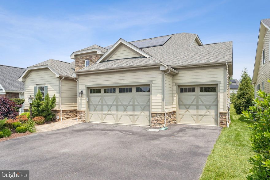 Welcome to this expansive and beautifully appointed Elate model by Shea Homes as part of the Trilogy at Lake Frederick 55+ community. This home features three finished levels with five bedrooms, four full and one half bathrooms, a three-car garage, a loft with a private guest suite, and a fully finished basement with a large wet bar, abundant storage, and even solar panels. From the moment you step inside, you’re greeted by a bright, open floor plan that effortlessly blends generous living spaces for seamless everyday living and entertaining.
<br><br>
At the heart of the home is the impressive great room, where the living, dining, and kitchen areas flow together to create a connected and inviting space. The gourmet kitchen is a chef’s dream, showcasing a massive island with seating, granite countertops, a gas cooktop with an overhead range hood, stainless steel appliances, a double wall oven, and abundant cabinetry and prep space.  The adjacent living area features custom built-in shelving, an entertainment center, and a cozy gas fireplace, all illuminated by recessed lighting throughout. A spacious laundry room offers built-in storage, folding space, and practical functionality.
<br><br>
Two bedrooms are conveniently located on the main level, including the luxurious primary suite. The primary bedroom offers private access to the screened-in rear porch with a gas fireplace, a dedicated mini-split system for personalized climate control, a spa-inspired ensuite bath, and a large walk-in closet.  Upstairs, a versatile loft offers an oversized family room, a full bathroom, and an additional bedroom—ideal for guests or extended family. The fully finished basement expands the living space even further, featuring a wet bar, open recreation area, and plenty of room for a home theater, gym, or hobby room.
<br><br>
The expansive three-car garage offers abundant storage and practical convenience for daily living. Step out to the screened-in rear porch with a cozy fireplace—an ideal spot for relaxing or entertaining year-round. Every detail of this thoughtfully crafted home is designed to elevate modern living with the perfect blend of comfort, style, and functionality.
<br><br>
As a resident of Trilogy at Lake Frederick, the region's premier Active Adult community, you'll enjoy a wealth of incredible amenities designed to enhance your lifestyle. Dive into relaxation with both indoor and outdoor pools, stay active in the state-of-the-art fitness center, and unwind at the well-equipped community clubhouse. Savor gourmet meals at the farm-to-table restaurant and socialize in the exclusive members-only lounge. For the sports enthusiasts, tennis and pickleball courts, as well as a dog park, offer ample opportunities for recreation, while extensive lake trails beckon for serene strolls and outdoor adventures. Join a vibrant community of welcoming neighbors and future friends. Experience the pinnacle of resort living at Trilogy at Lake Frederick—where your dream home and ideal lifestyle come together seamlessly.