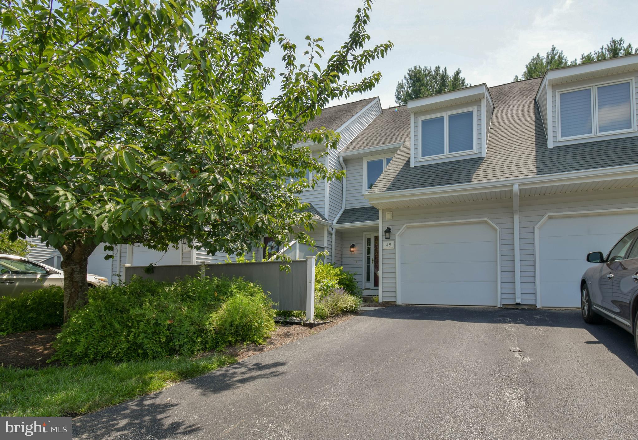 Welcome to 49 East Jonathan Court – a beautifully maintained 3-bedroom, 2.5-bath townhome in the heart of charming Kennett Square! Located in the sought-after Orchard Valley community, this spacious home offers the perfect blend of comfort and convenience. Step into an open-concept main level featuring hardwood floors, a bright and airy living room with a fireplace, and a dining area that flows into the kitchen with stainless steel appliances and ample cabinet space. Upstairs, the primary suite boasts its own full bath.. the 3rd floor bedroom has vaulted ceilings, double closets. Rounding out the upper level is another bedrooms and a full hall bath. Enjoy peaceful mornings or relaxing evenings on your private deck backing to a quiet wooded area. Other highlights include a finished walk-out basement, attached one-car garage, central air, and second-floor laundry. Minutes from downtown Kennett Square’s shops, dining, and events, and with easy access to Rt 1 and Longwood Gardens, this home offers both lifestyle and location. Available for immediate occupancy – schedule your showing today!