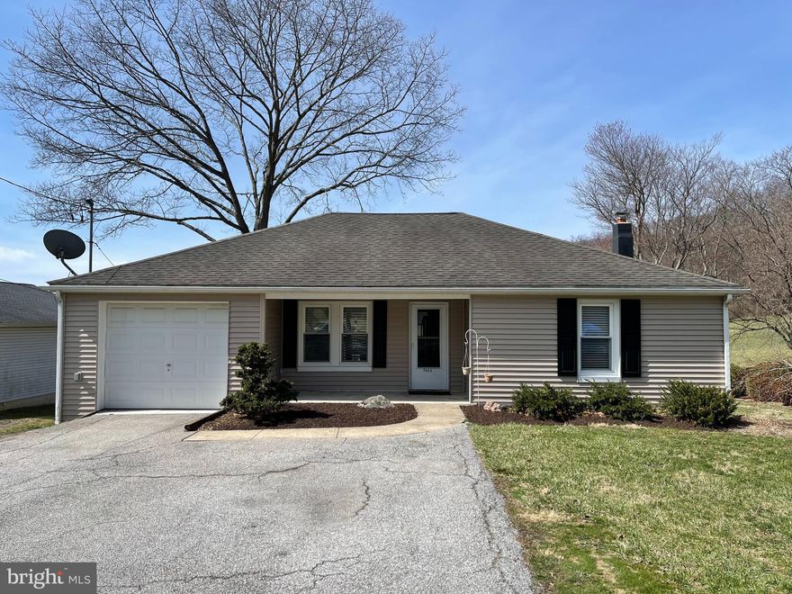 Welcome home to this wonderful cozy 2 bedroom 1 bath ranch home.  Enjoy the tranquil and beautiful sunsets on the expansive wood decks. Updated kitchen with tile flooring, granite countertops with a cool toboggan breakfast bar.  Hardwood flooring in living room and bedrooms.  Laundry on main floor.  Walk out basement. Enjoy relaxing in the sitting area or gardening in the greenhouse and raised garden beds. Schedule your personal showing today!